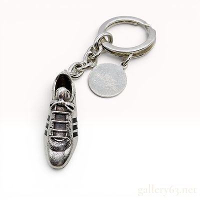 Tiffany and Co. Sterling Silver Nestle Super Soccer Shoe Keychain. This is a Tiffany and Co. 