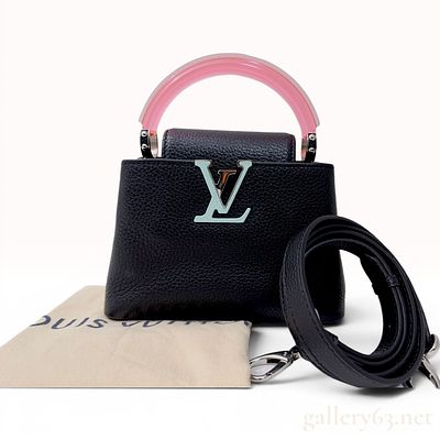 Louis Vuitton Capucines Mini Handbag in Black Taurillon Leather with Pink Plexiglass Handle. This 