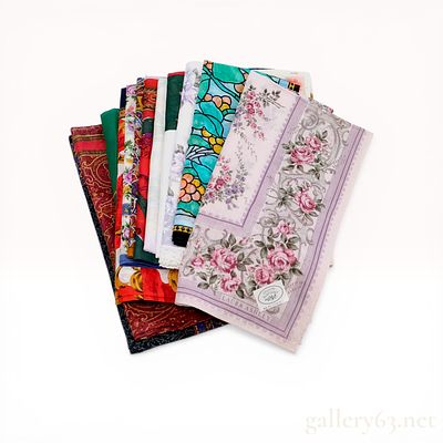 A Collection of Designer Handkerchiefs Including Celine, Laura Ashley, and Yves Saint Laurent. An 
