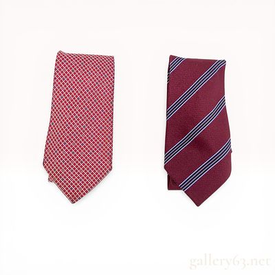 Two Chanel Silk Neckties. Two Chanel silk neckties featuring distinct patterns, handcrafted in 