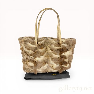 Fendi Pieced Fur Tote Bag with Lizard Leather Handles. Fendi shoulder bag featuring a pieced fur 