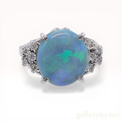 Opal and Diamond Platinum Cocktail Ring. Vintage-style cocktail ring featuring a central oval 