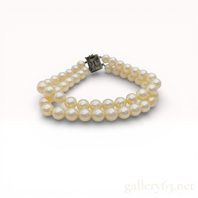 Vintage Cultured Pearl Two Strand Bracelet with Sterling Silver Clasp. A vintage double-strand 