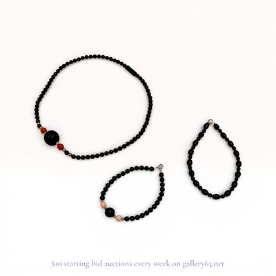 A Trio of Beaded Jewelry Including a Necklace and Two Bracelets. A trio of beaded jewelry 
