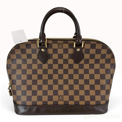 Louis Vuitton Damier Ebene Alma PM Handbag. A Louis Vuitton Alma PM handbag crafted from Damier 