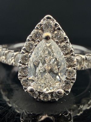 14K White Gold Natural Diamond Pear Shaped Ring. Center stone is .72 carat si2 g .35 carats side 