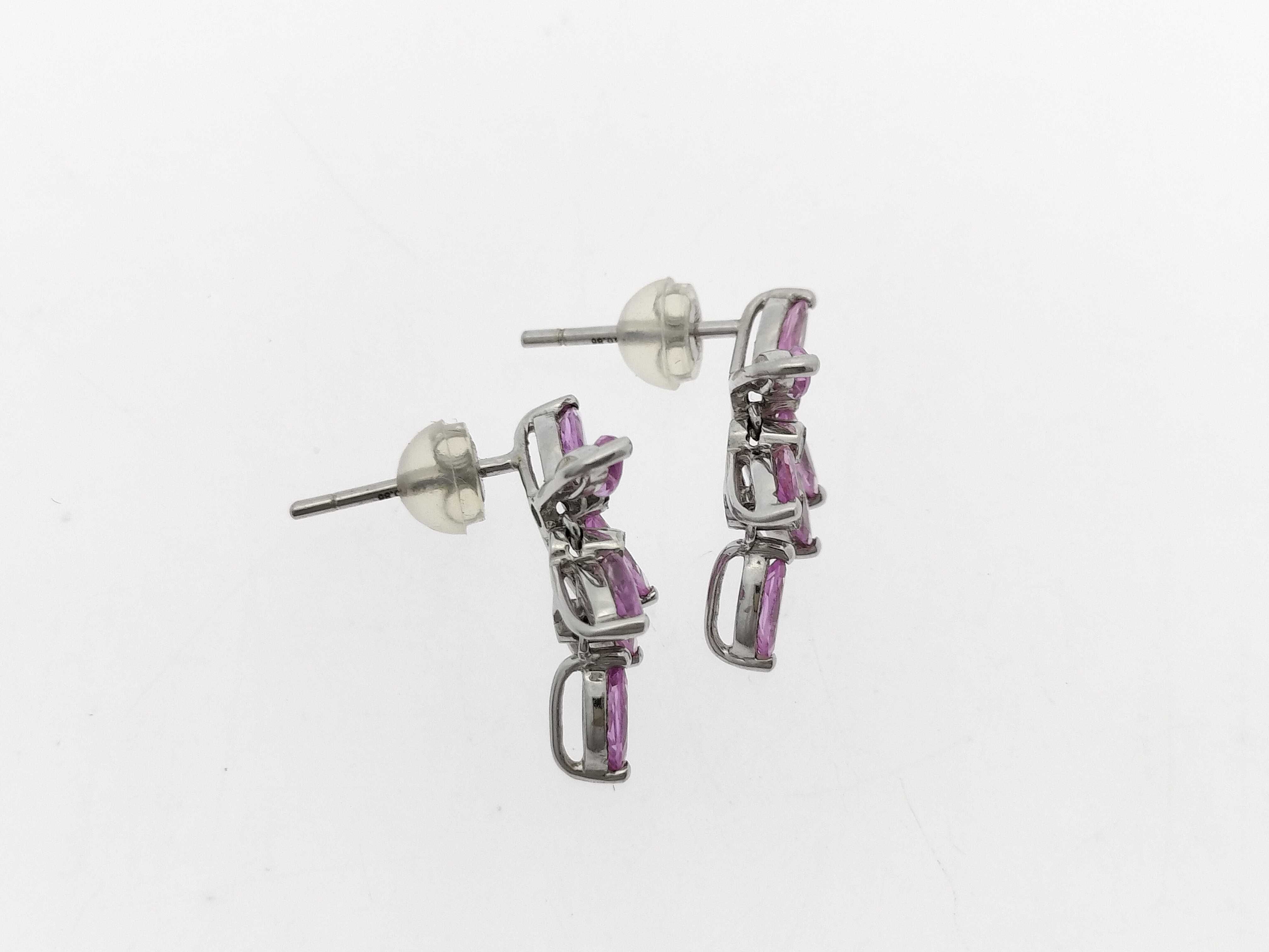 A Pair of 18K White Gold, Pink Sapphire, and Diamond Floral Cluster Drop Earrings