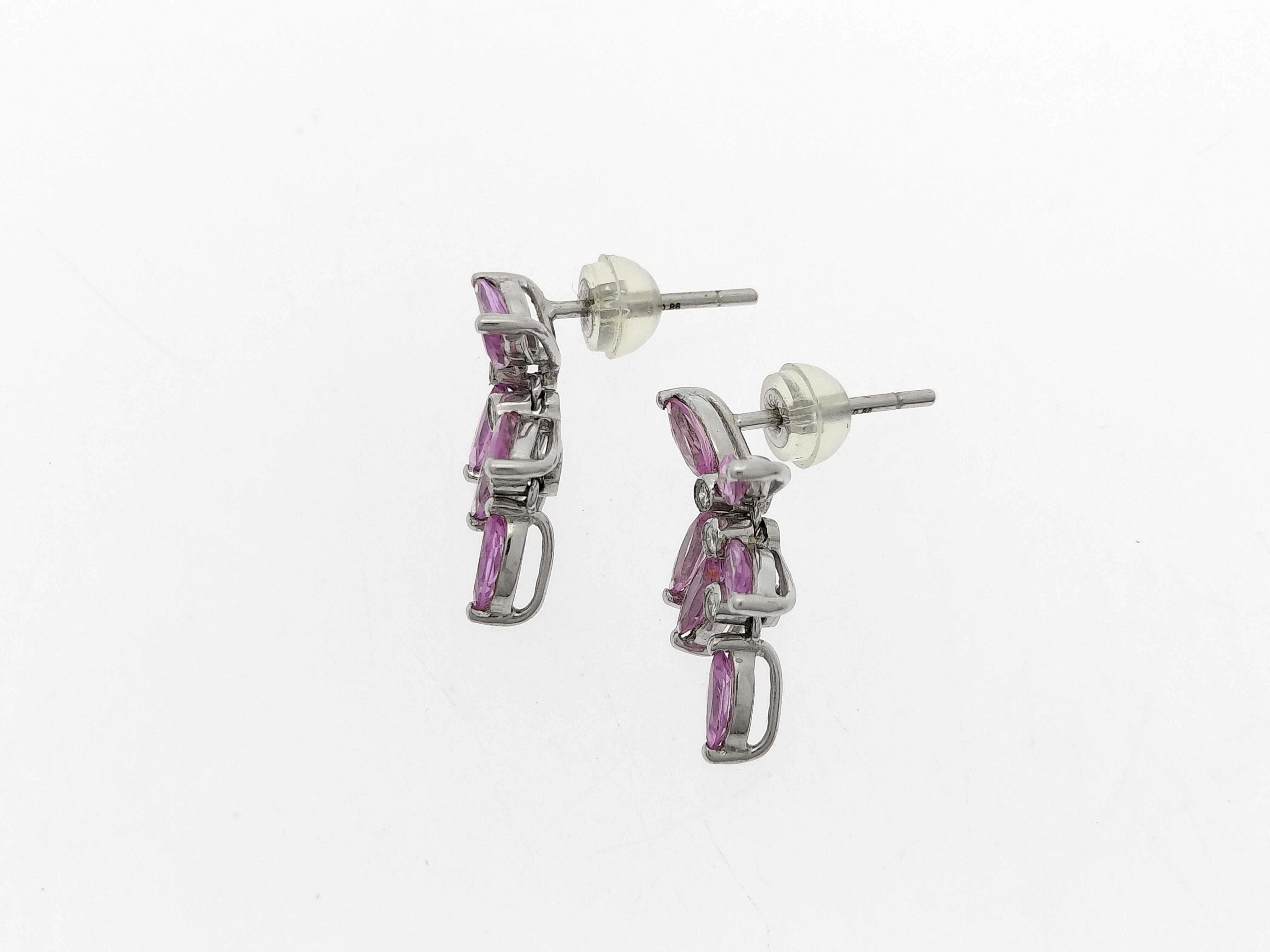A Pair of 18K White Gold, Pink Sapphire, and Diamond Floral Cluster Drop Earrings