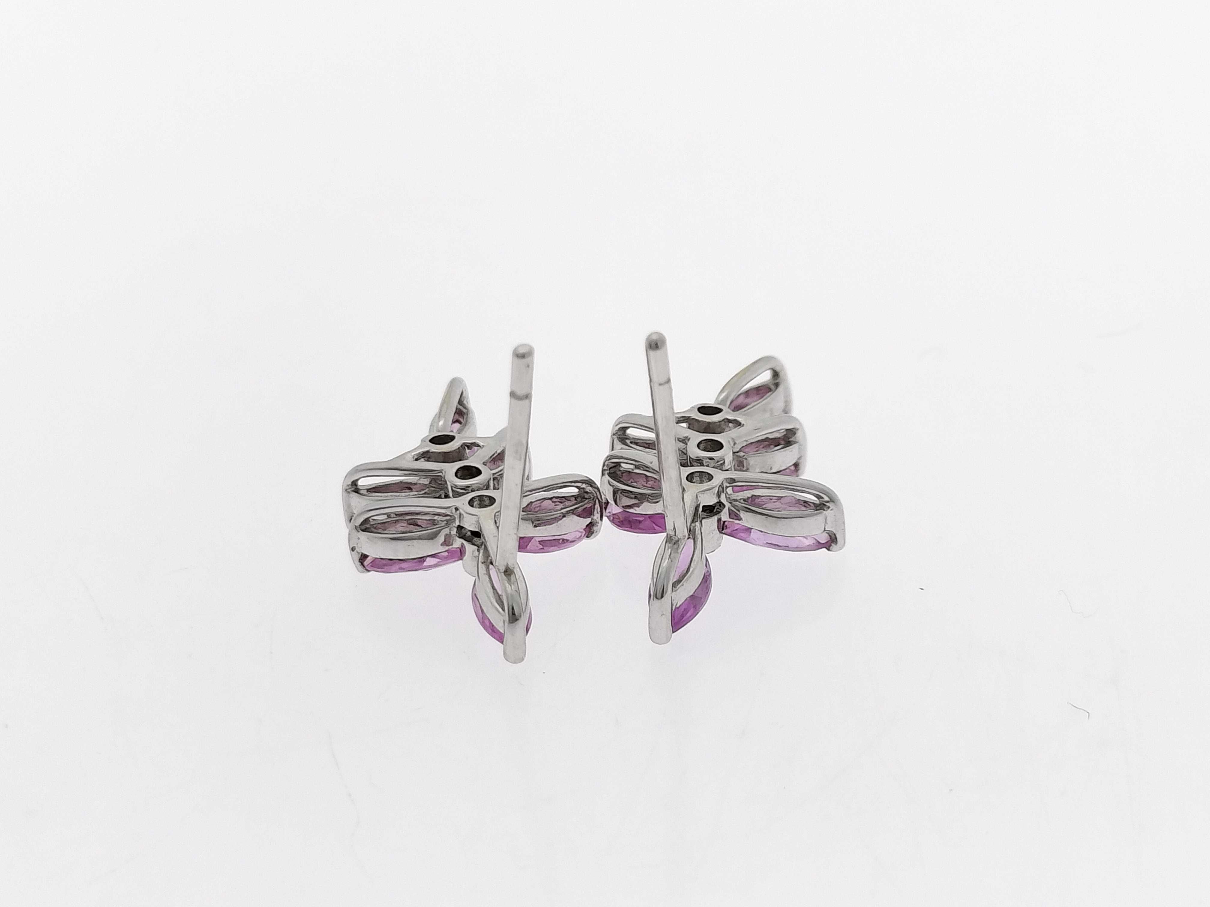 A Pair of 18K White Gold, Pink Sapphire, and Diamond Floral Cluster Drop Earrings