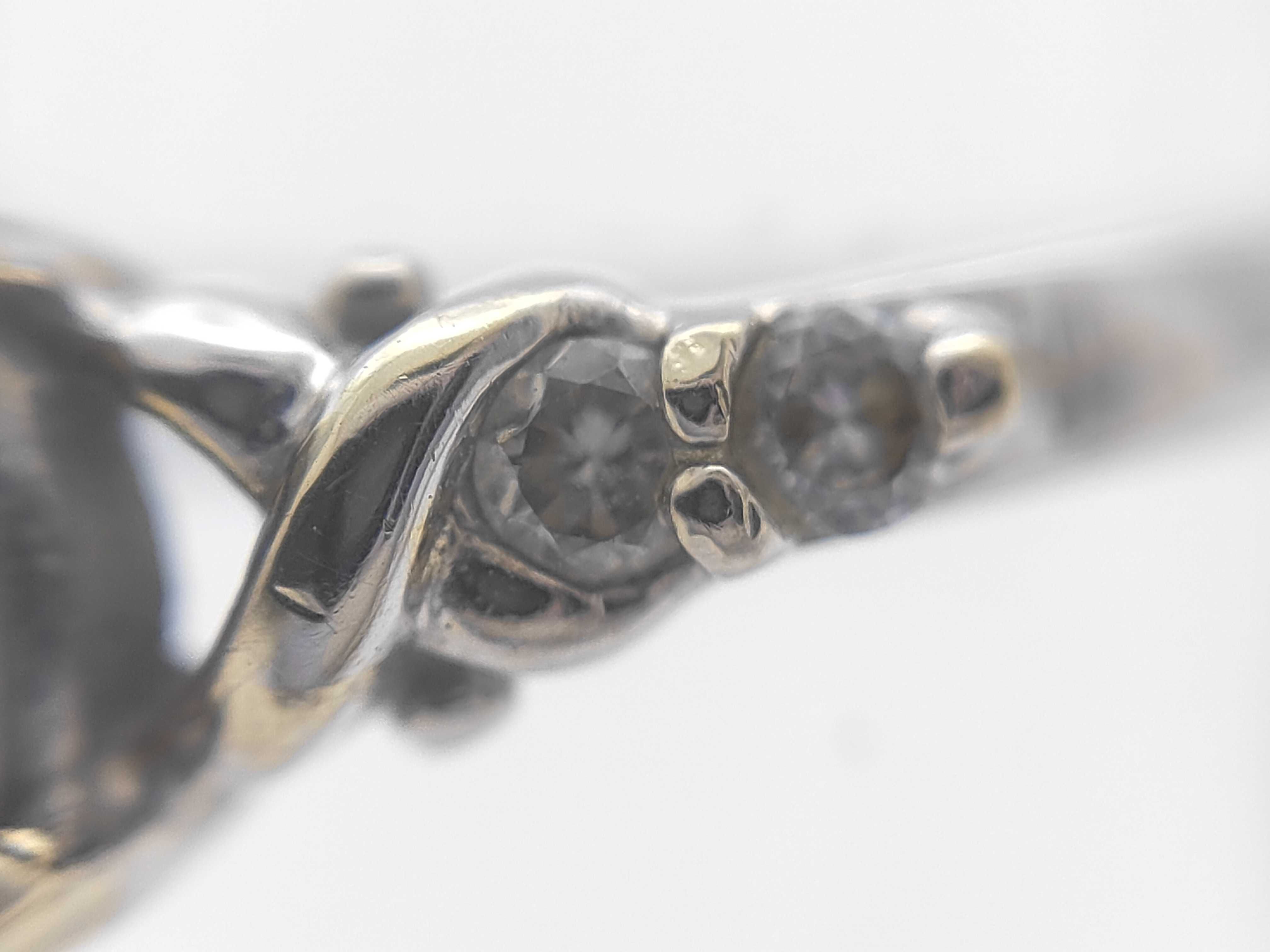An 18 Karat Two-Tone Gold Black Opal and Diamond Ring