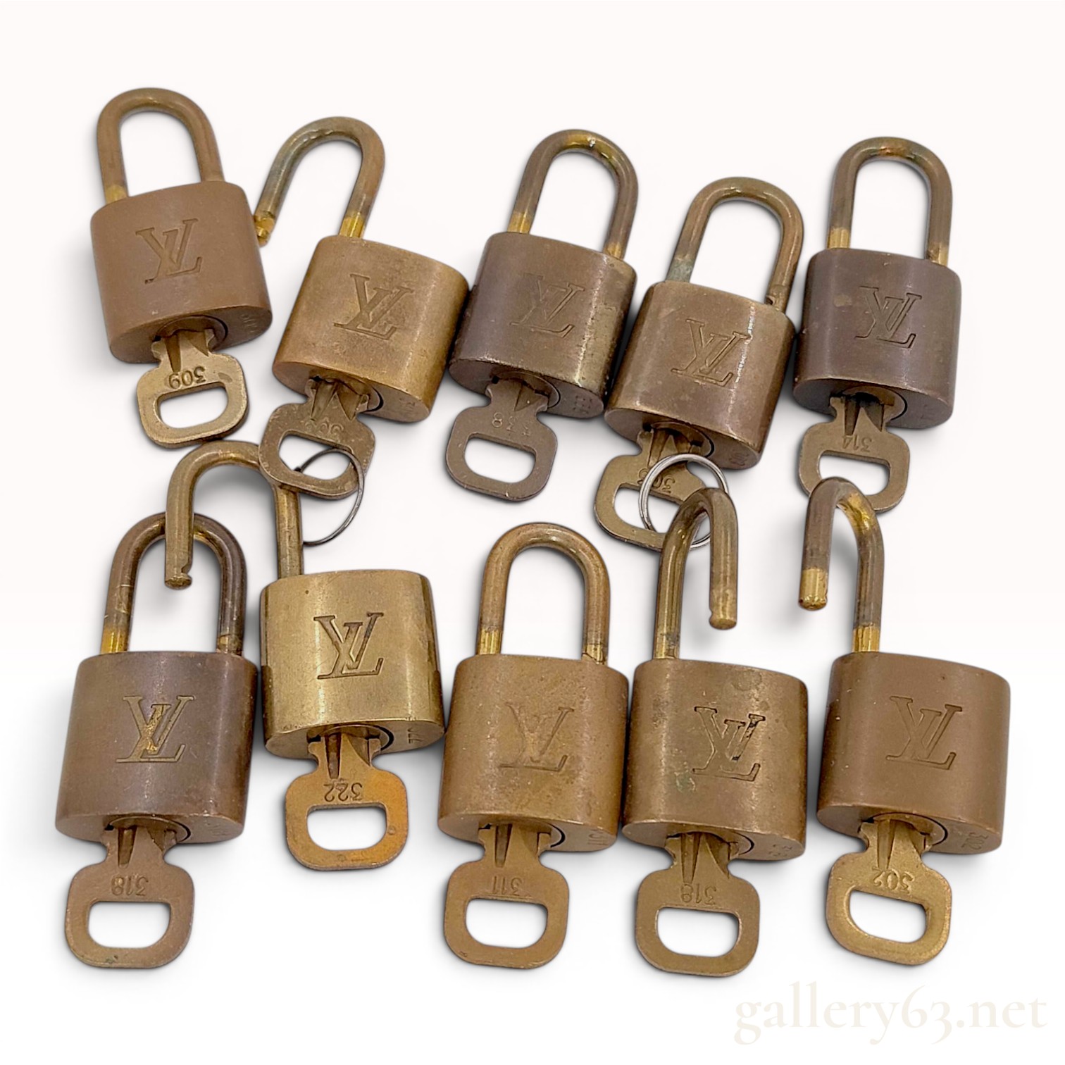 A Set of Ten Louis Vuitton Brass Padlocks and Keys