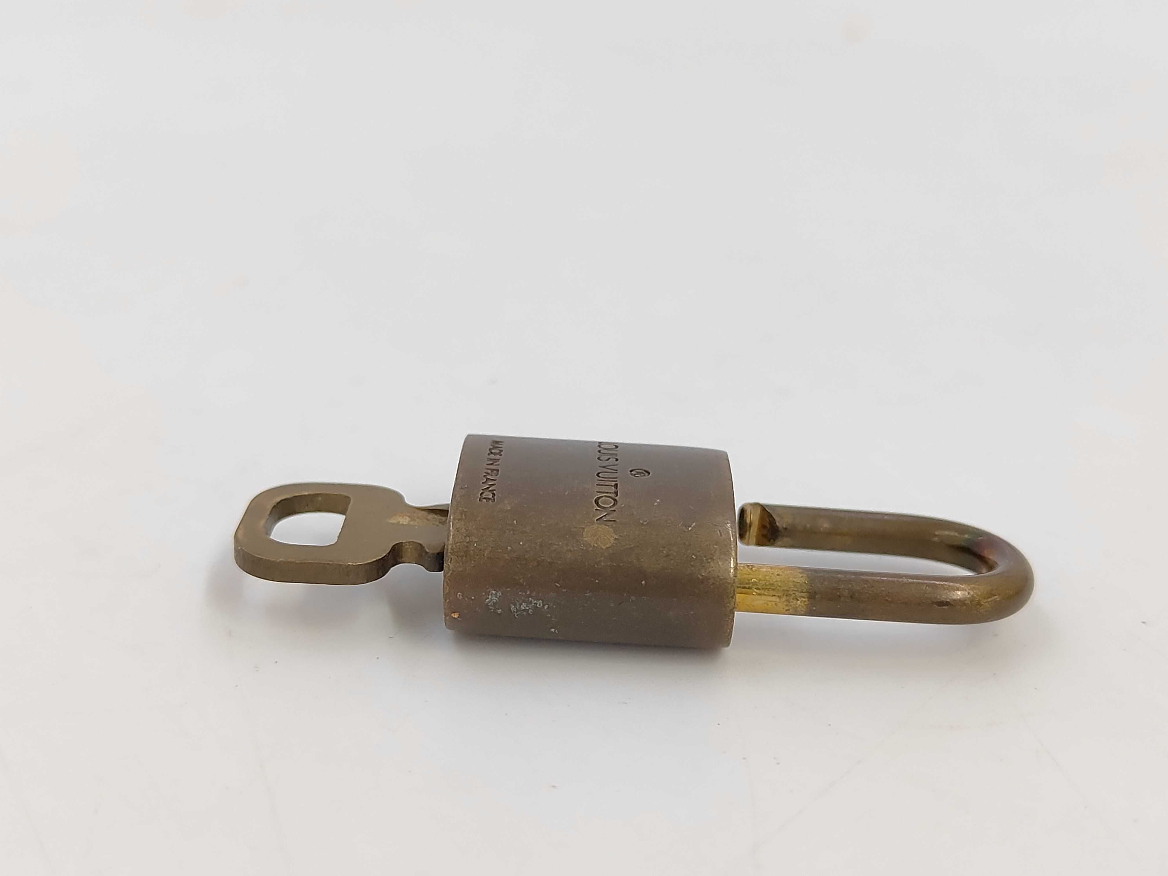 A Set of Ten Louis Vuitton Brass Padlocks and Keys
