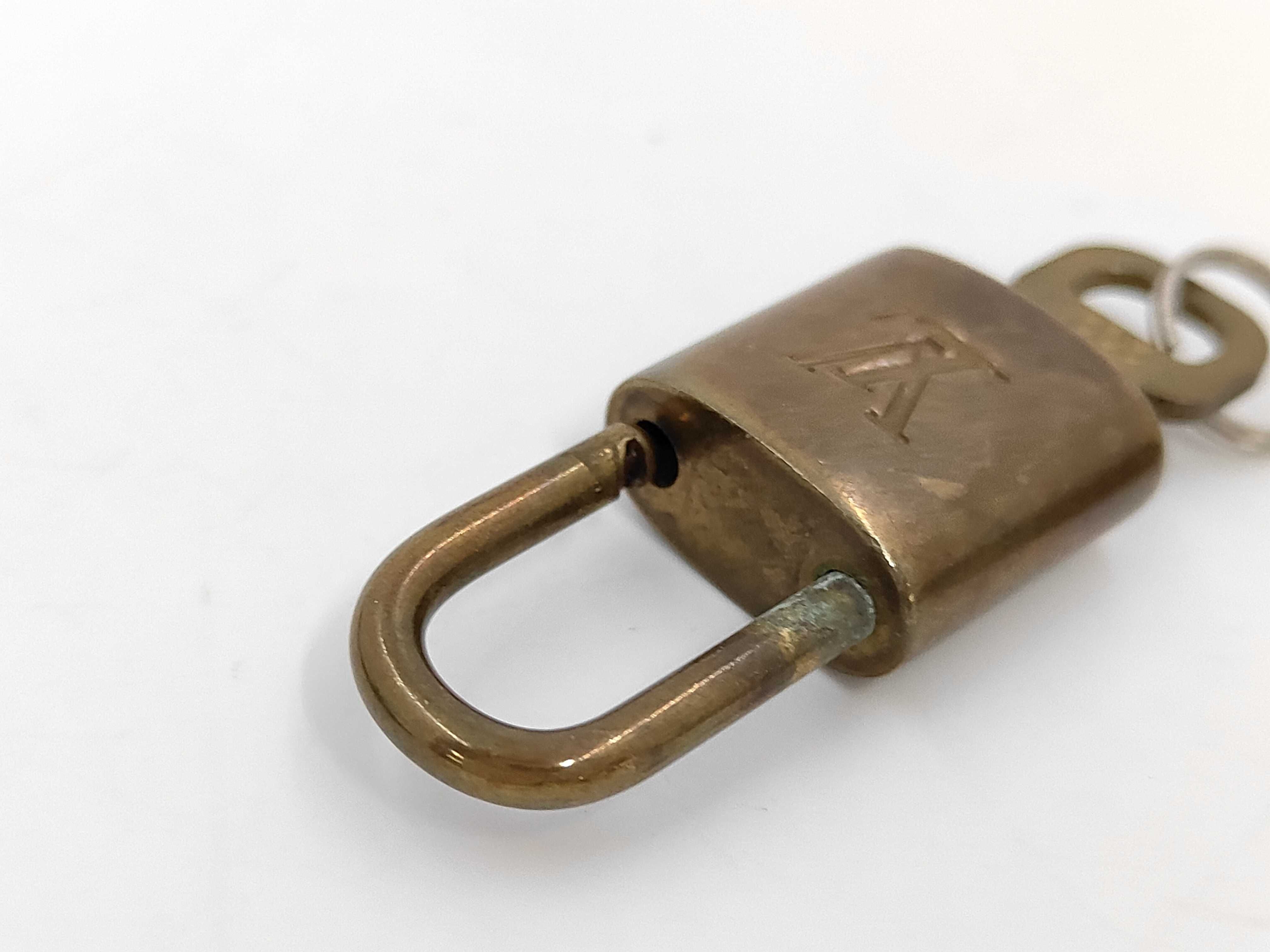 A Set of Ten Louis Vuitton Brass Padlocks and Keys