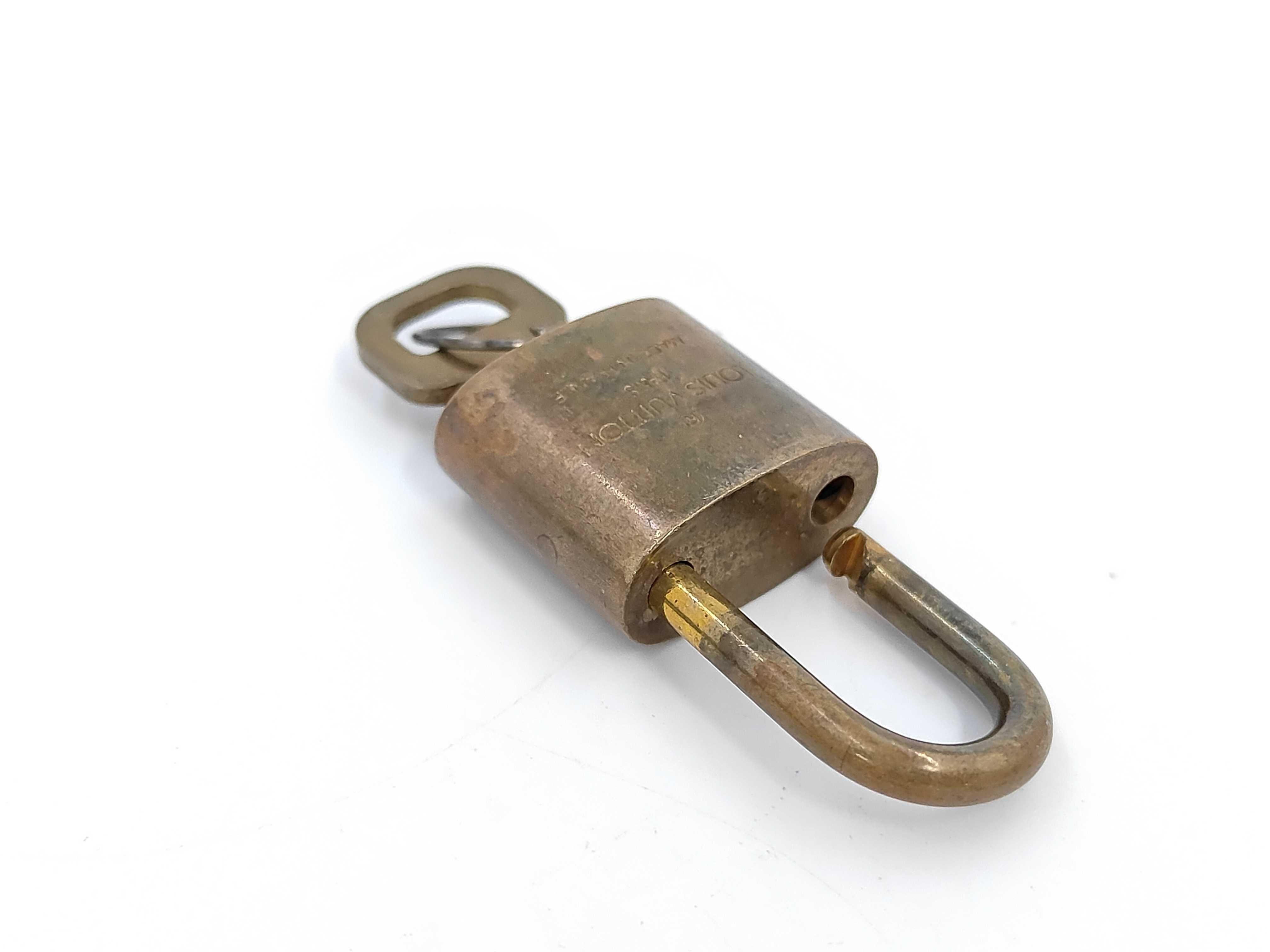 A Set of Ten Louis Vuitton Brass Padlocks and Keys