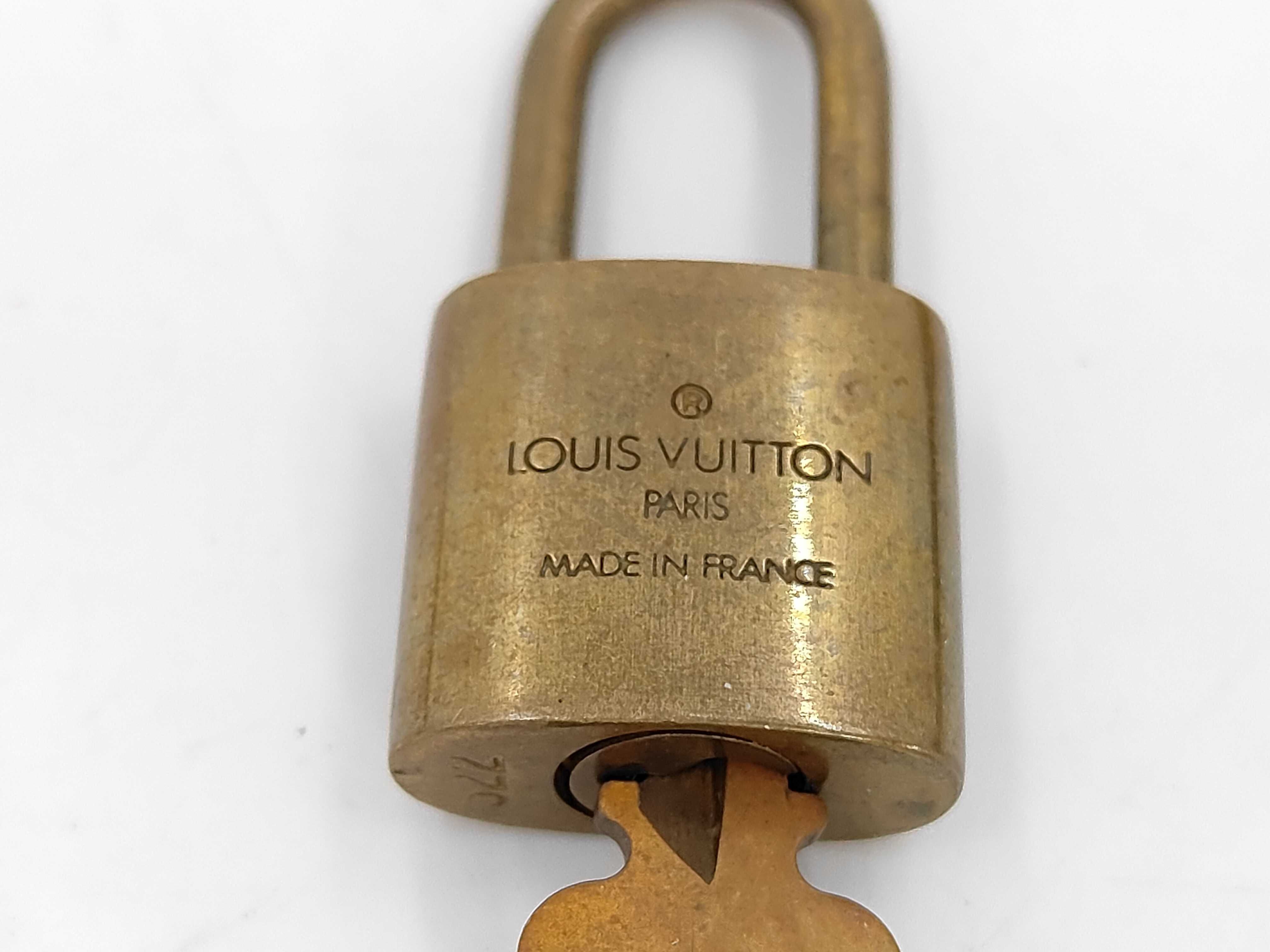 A Set of Ten Louis Vuitton Brass Padlocks and Keys