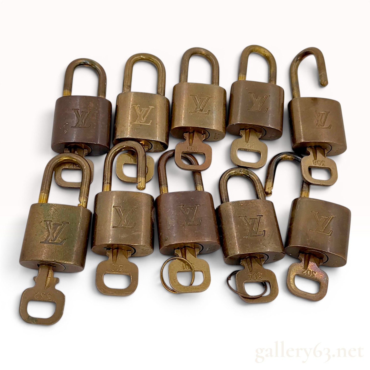 Lot of Ten Louis Vuitton Brass Padlocks with Matching Keys
