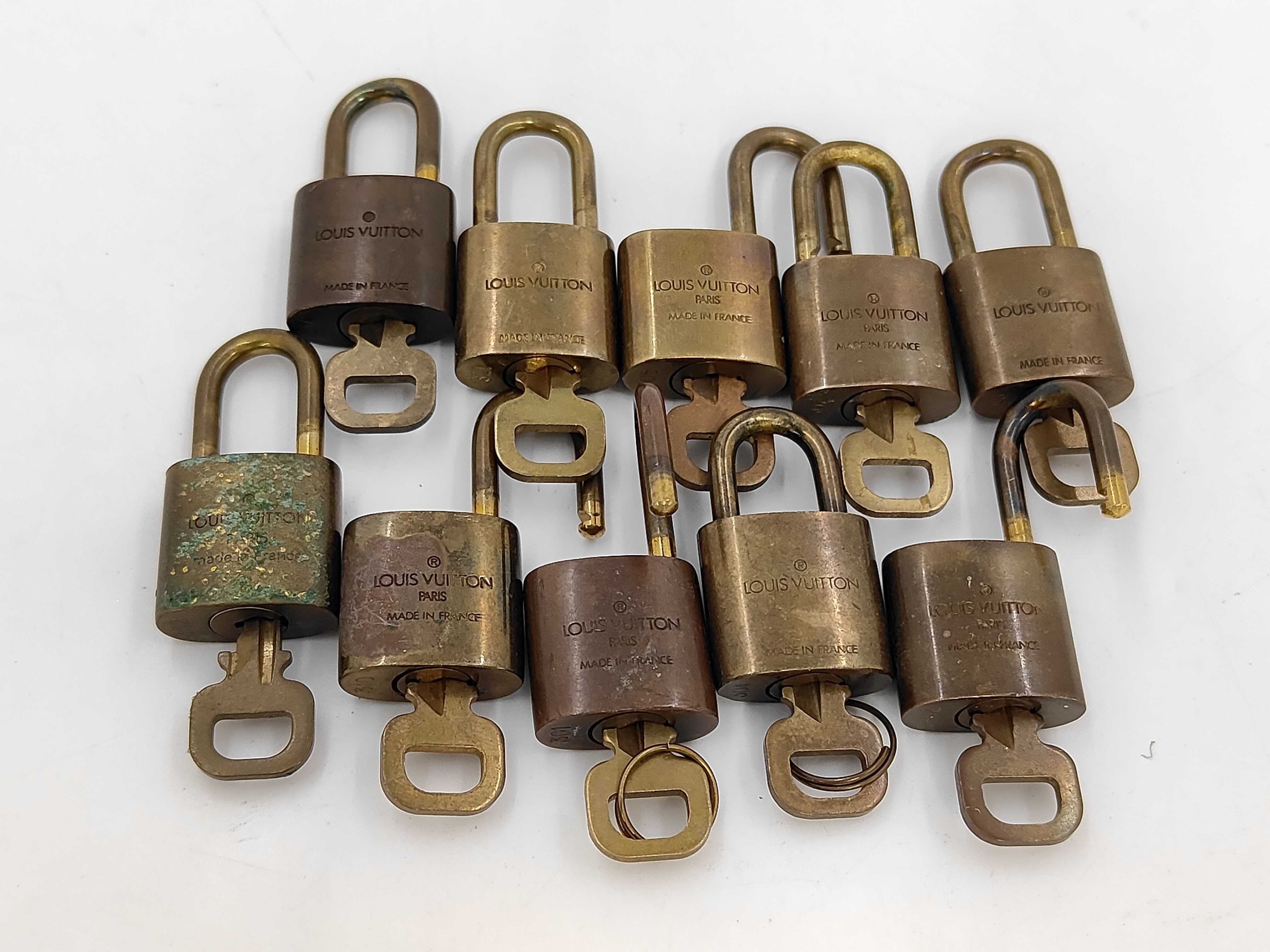 Lot of Ten Louis Vuitton Brass Padlocks with Matching Keys