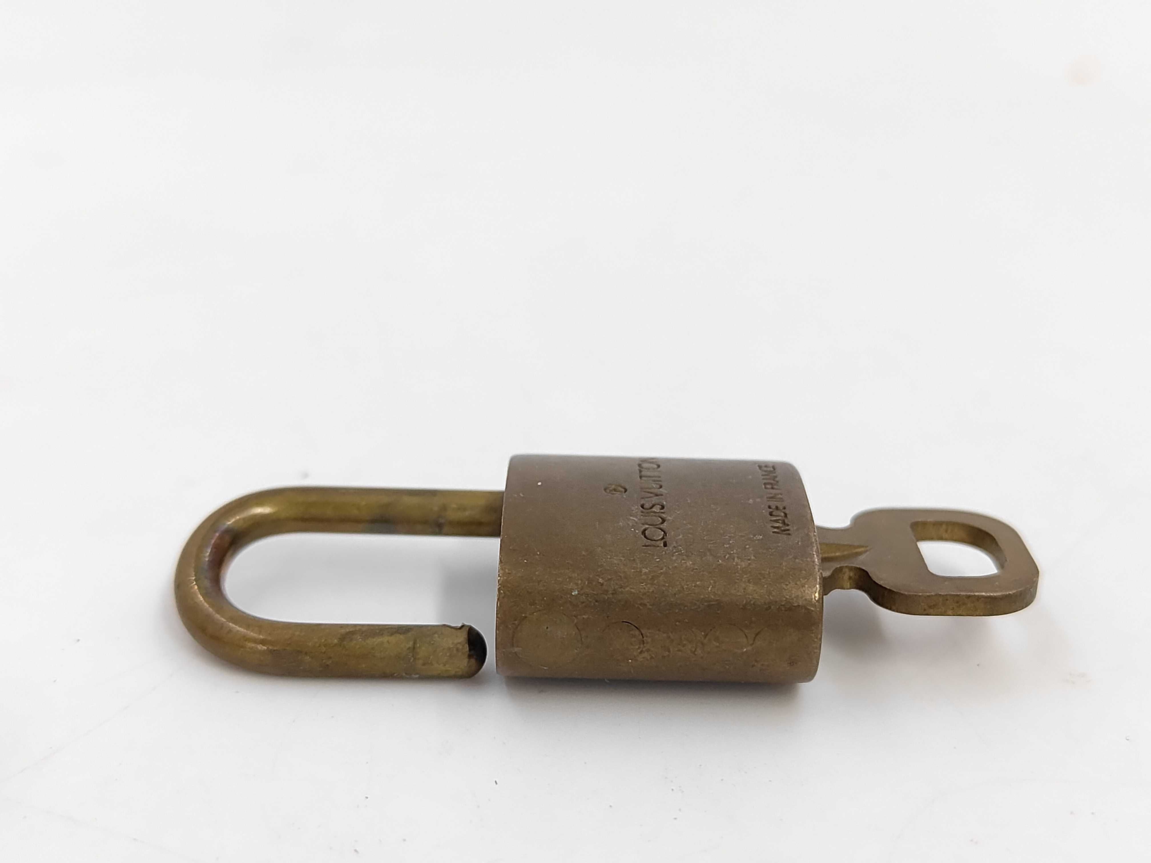 Lot of Ten Louis Vuitton Brass Padlocks with Matching Keys