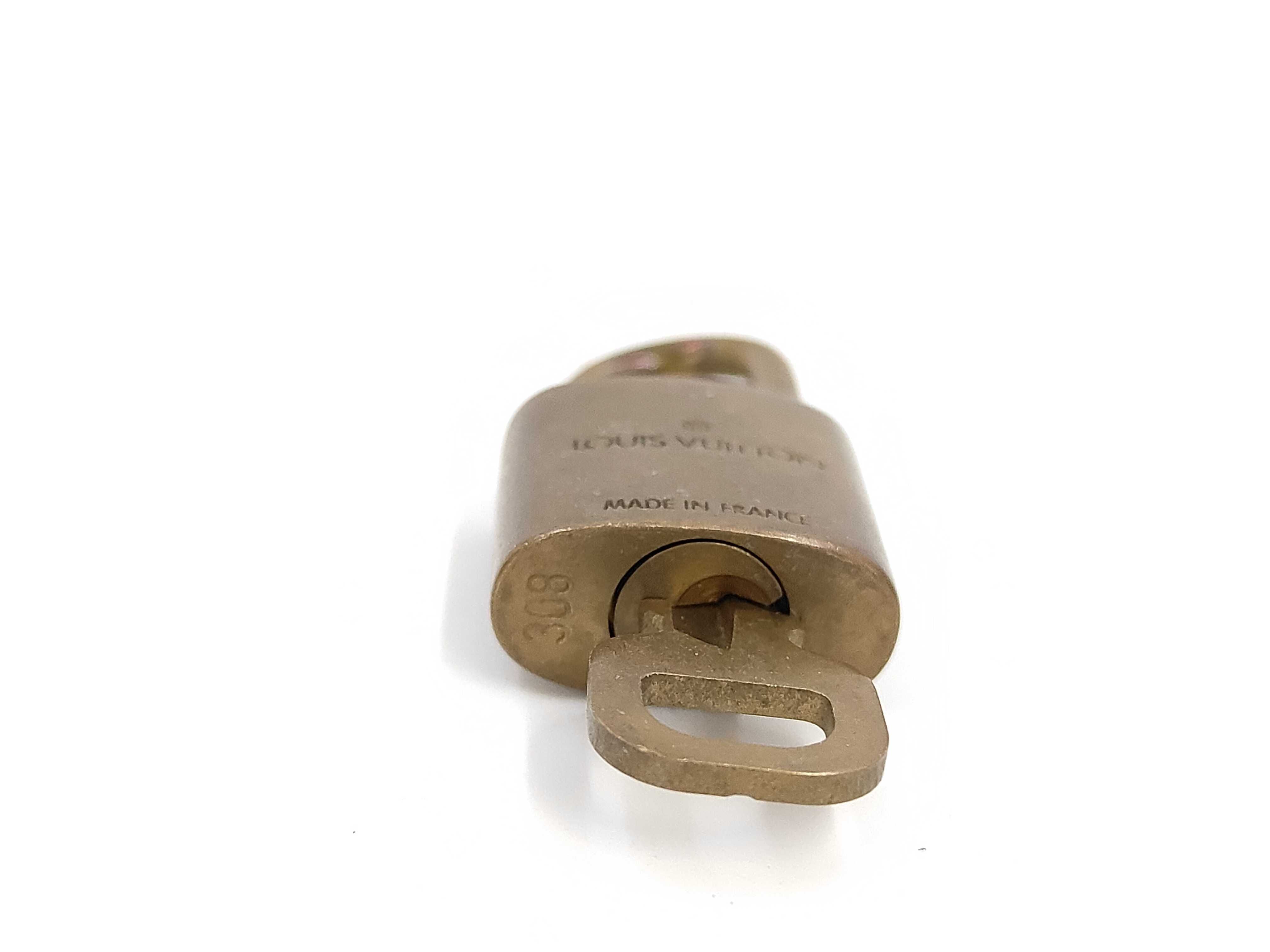 Lot of Ten Louis Vuitton Brass Padlocks with Matching Keys