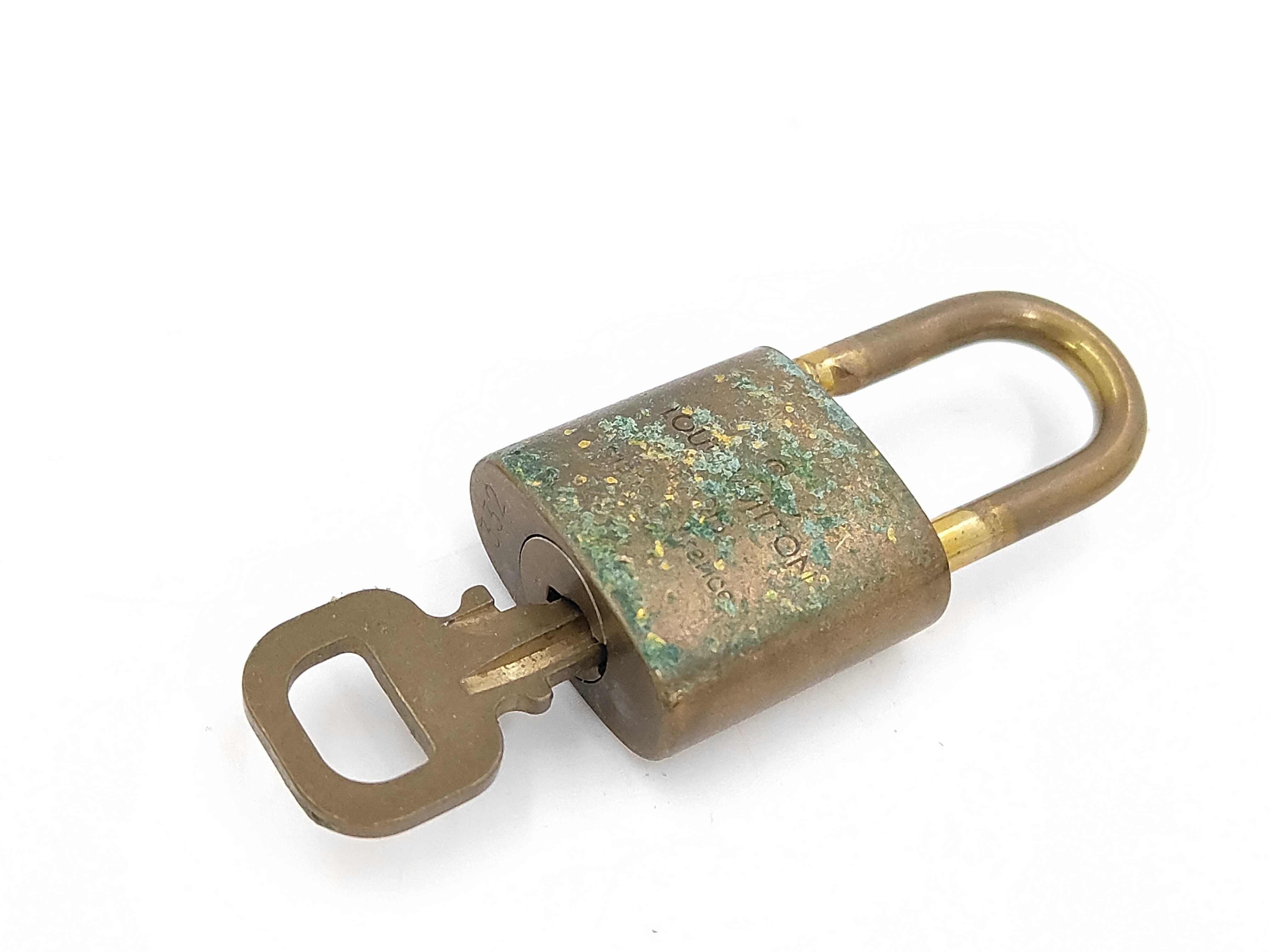 Lot of Ten Louis Vuitton Brass Padlocks with Matching Keys