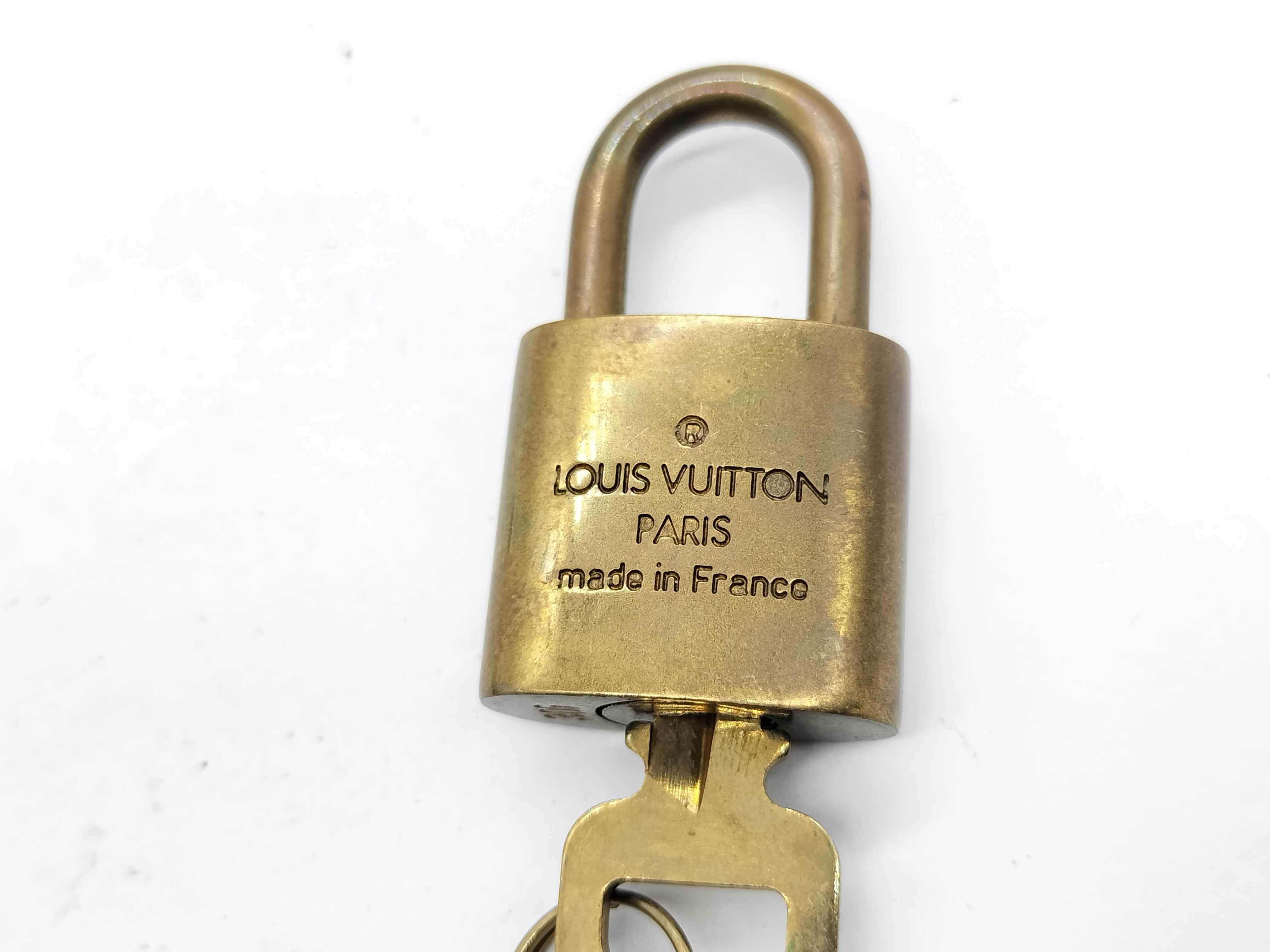 A Trio of Vintage Louis Vuitton Brass Luggage Padlocks with Matching Keys