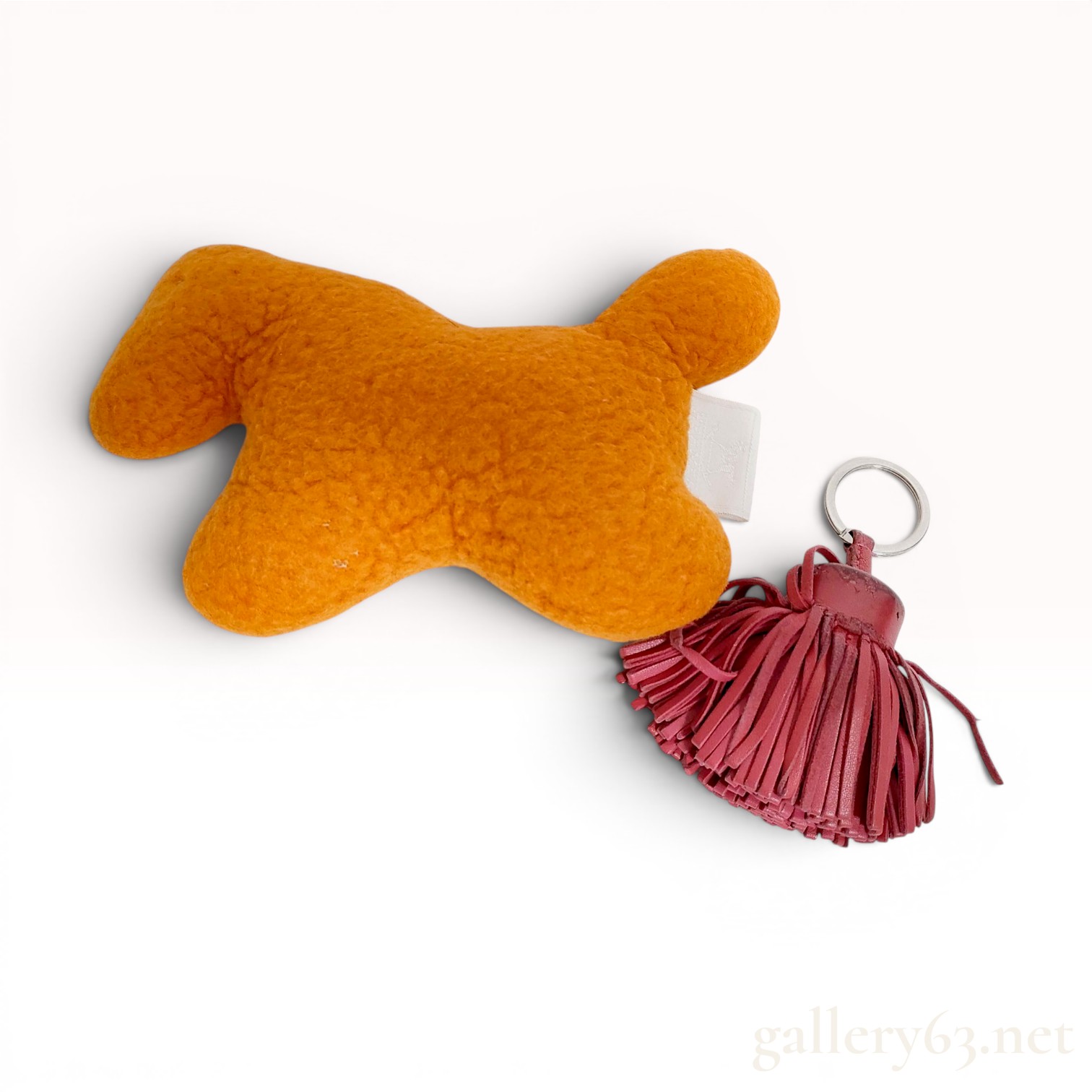 Two Hermès Accessories, Orange El Peluche Horse Plush and Burgundy Carmen Tassel Keychain