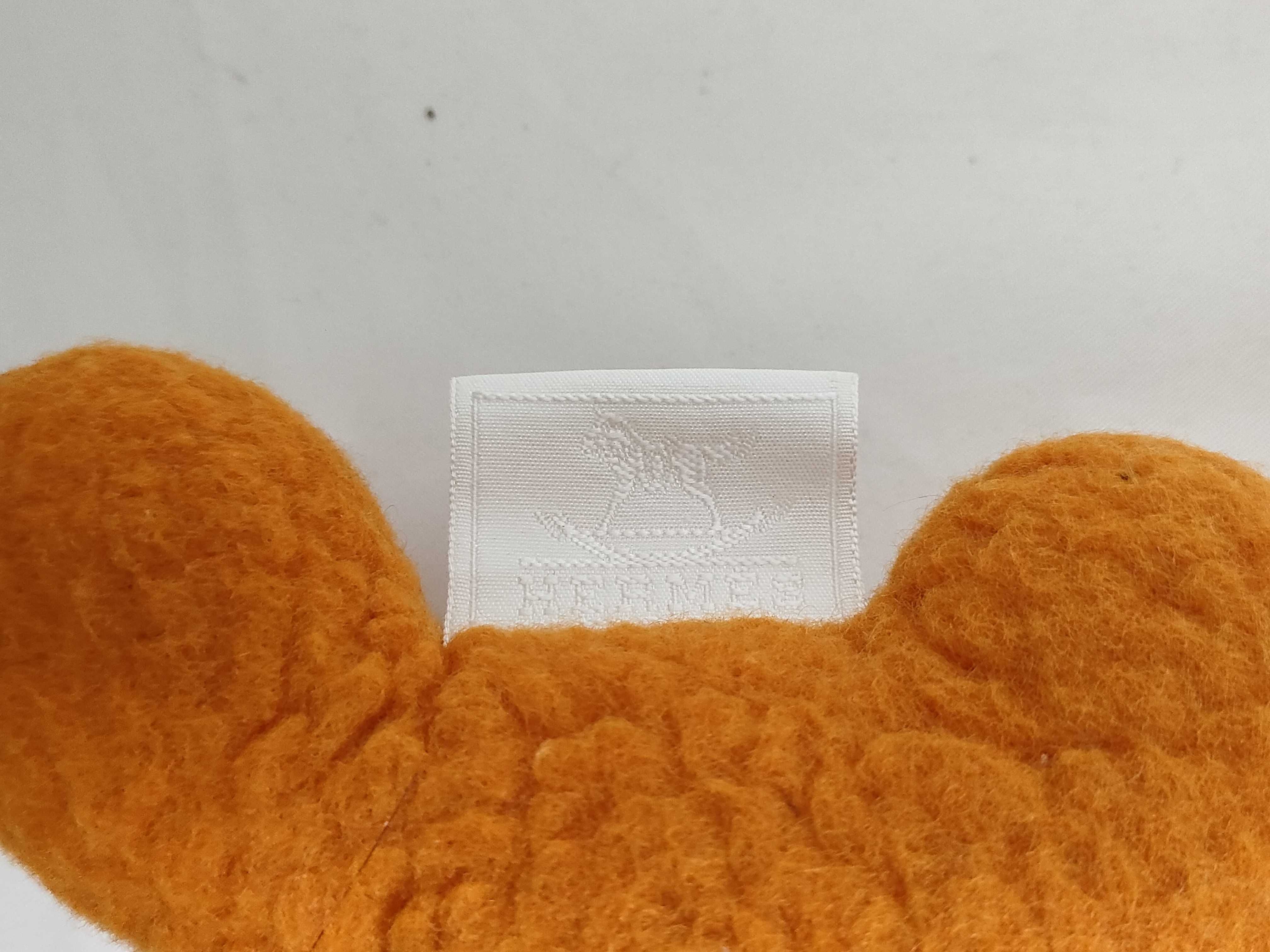 Two Hermès Accessories, Orange El Peluche Horse Plush and Burgundy Carmen Tassel Keychain