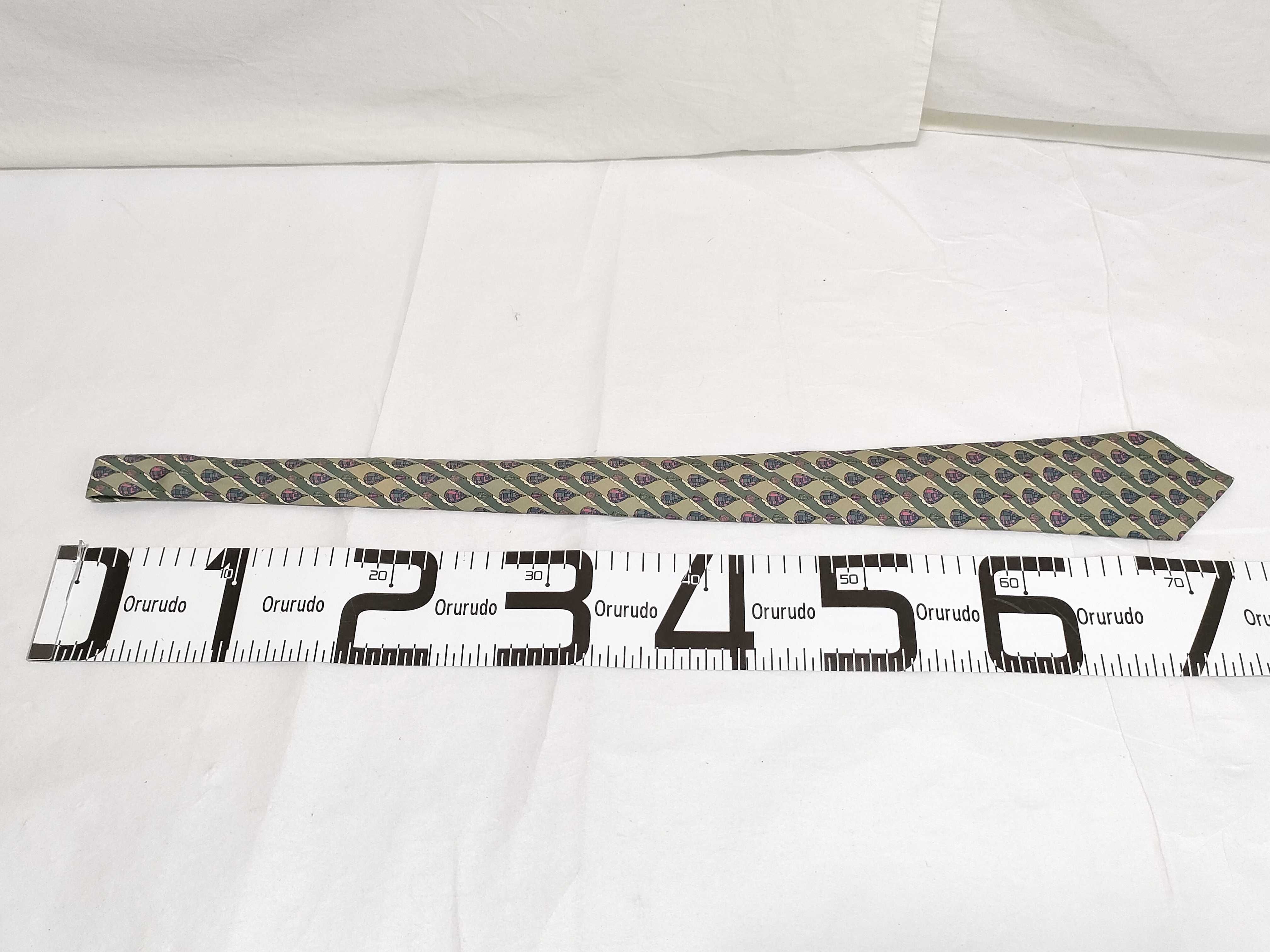 A Collection of Five Designer Silk Neckties Including Hermes, Celine, and Burberry
