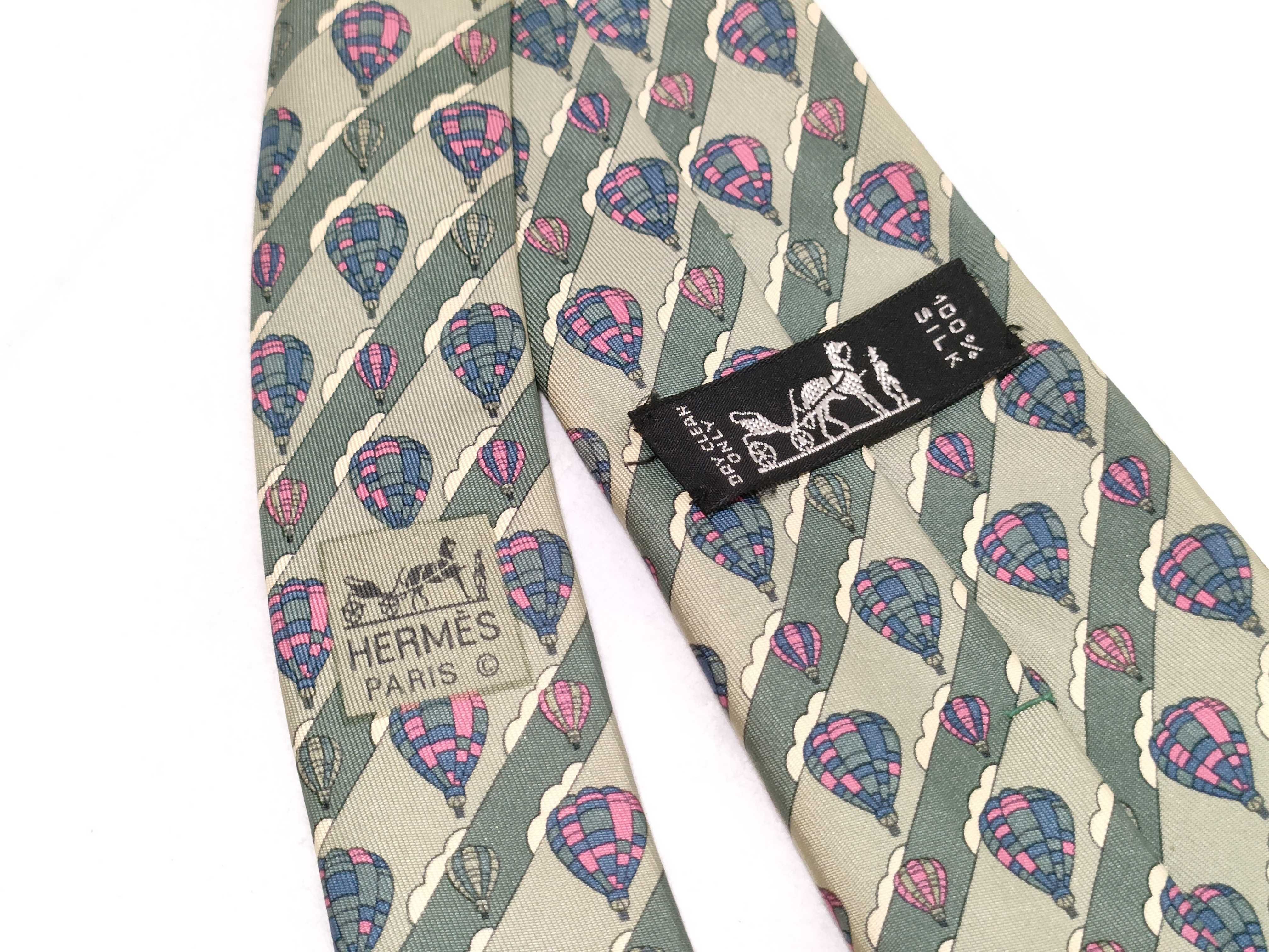 A Collection of Five Designer Silk Neckties Including Hermes, Celine, and Burberry