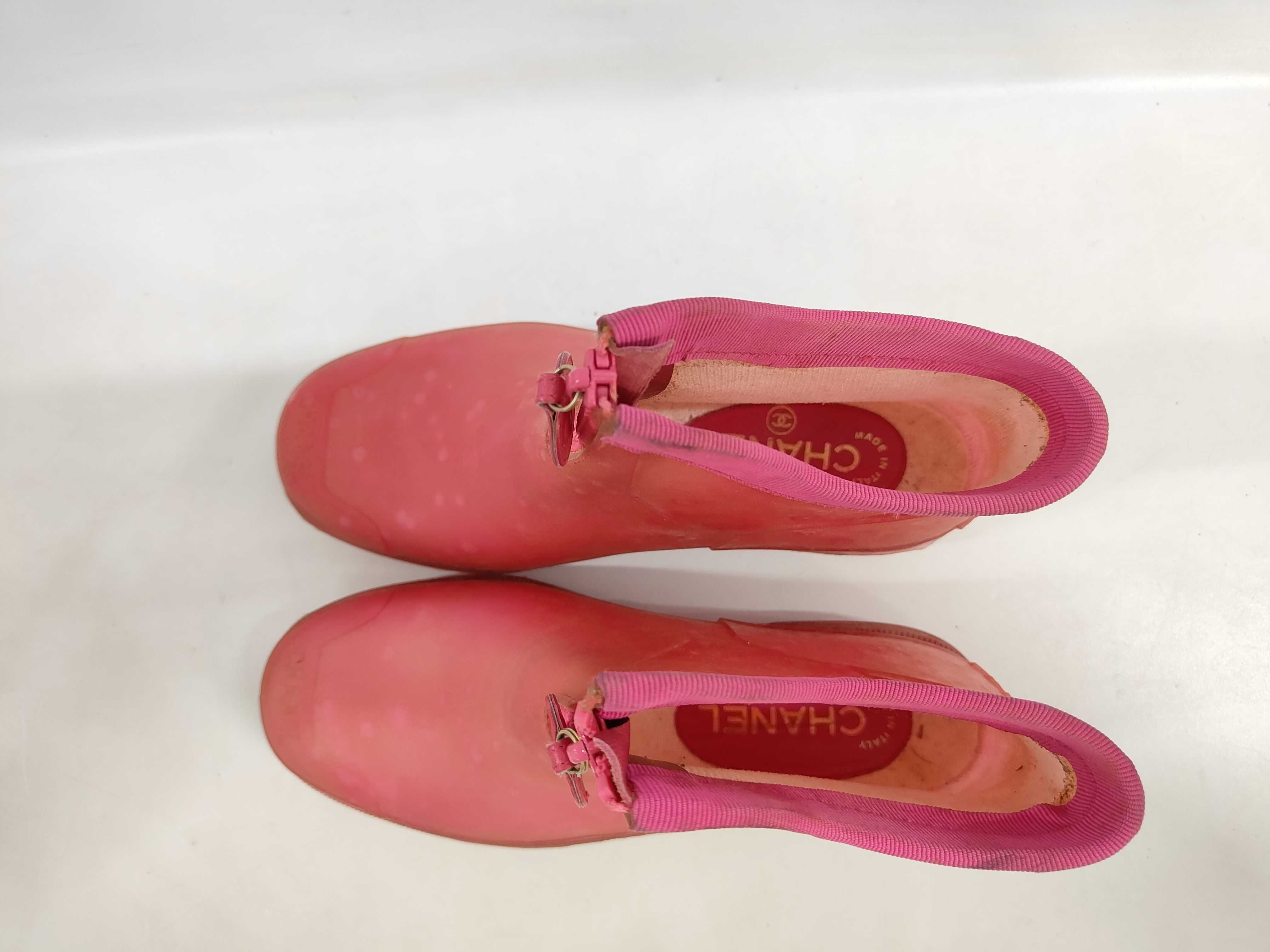 A Pair of Chanel Pink Polka Dot Translucent Rubber Front Zip Ankle Rain Boots Size 38