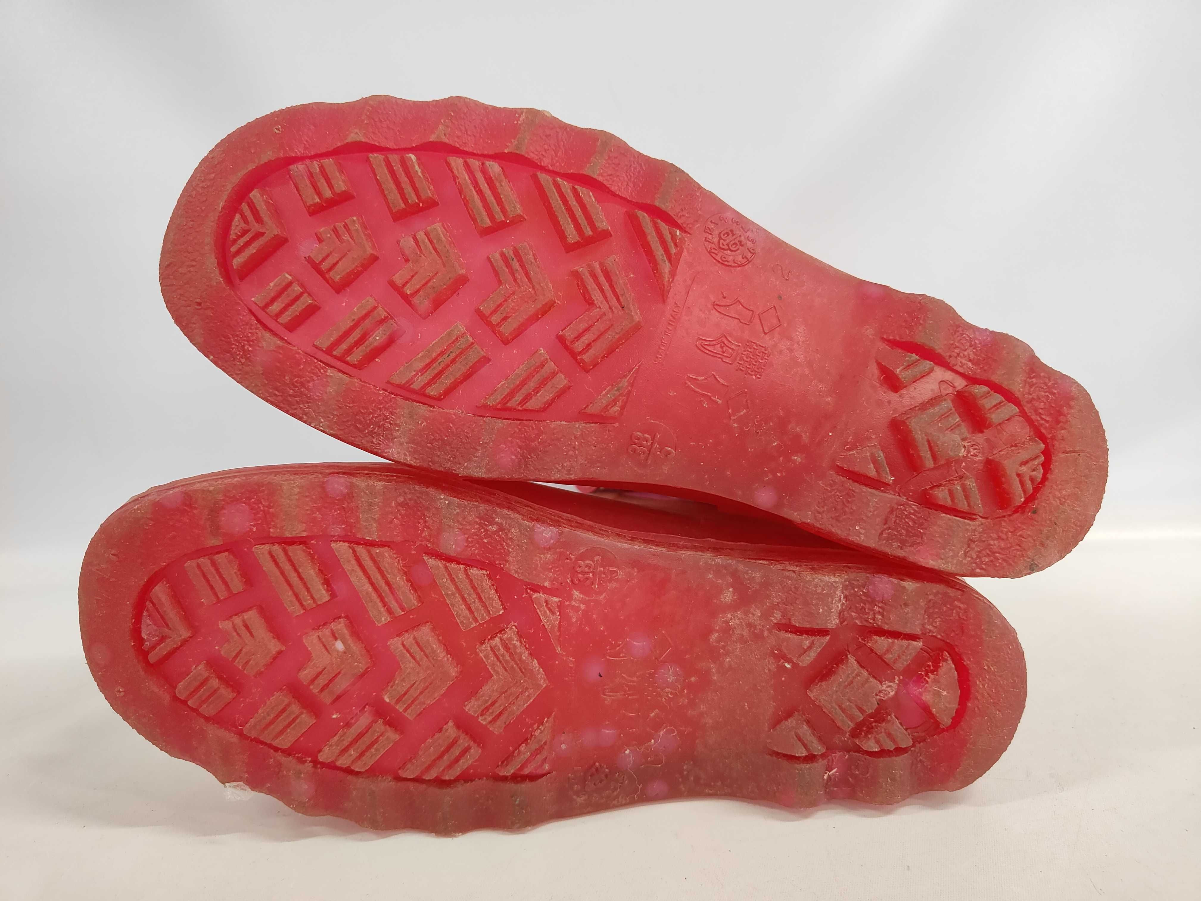 A Pair of Chanel Pink Polka Dot Translucent Rubber Front Zip Ankle Rain Boots Size 38
