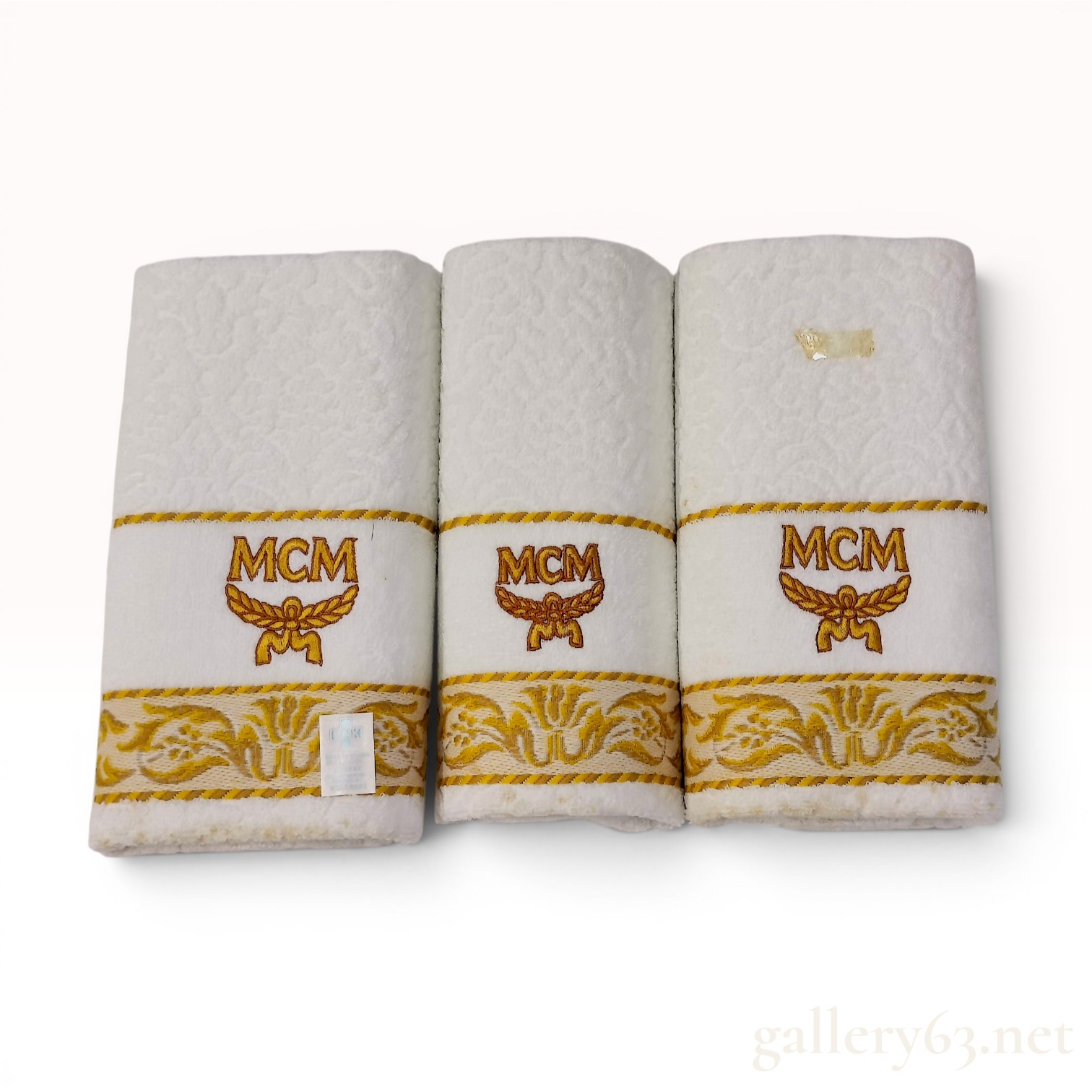 A Trio of MCM Branded Hand Towels