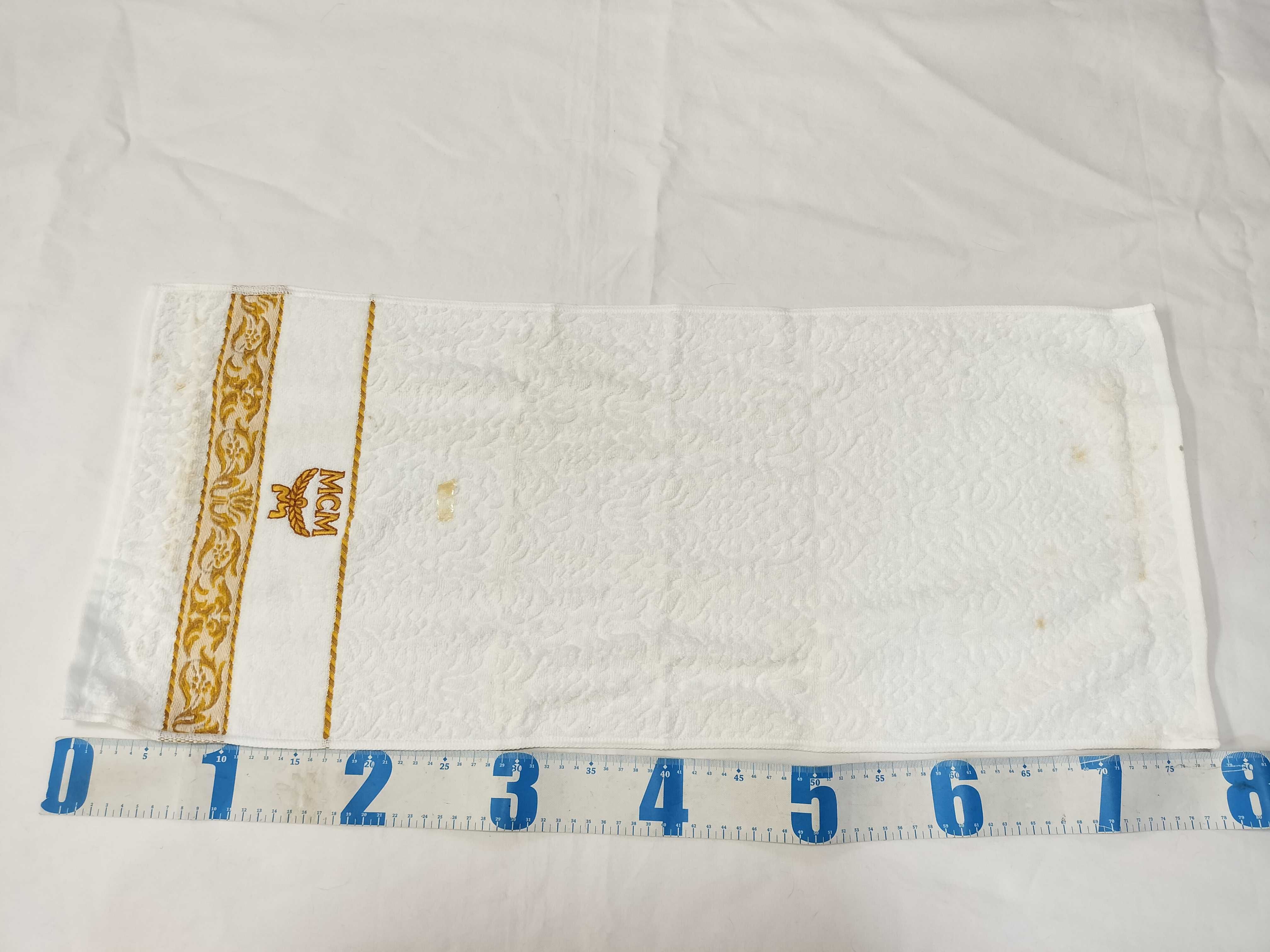 A Trio of MCM Branded Hand Towels