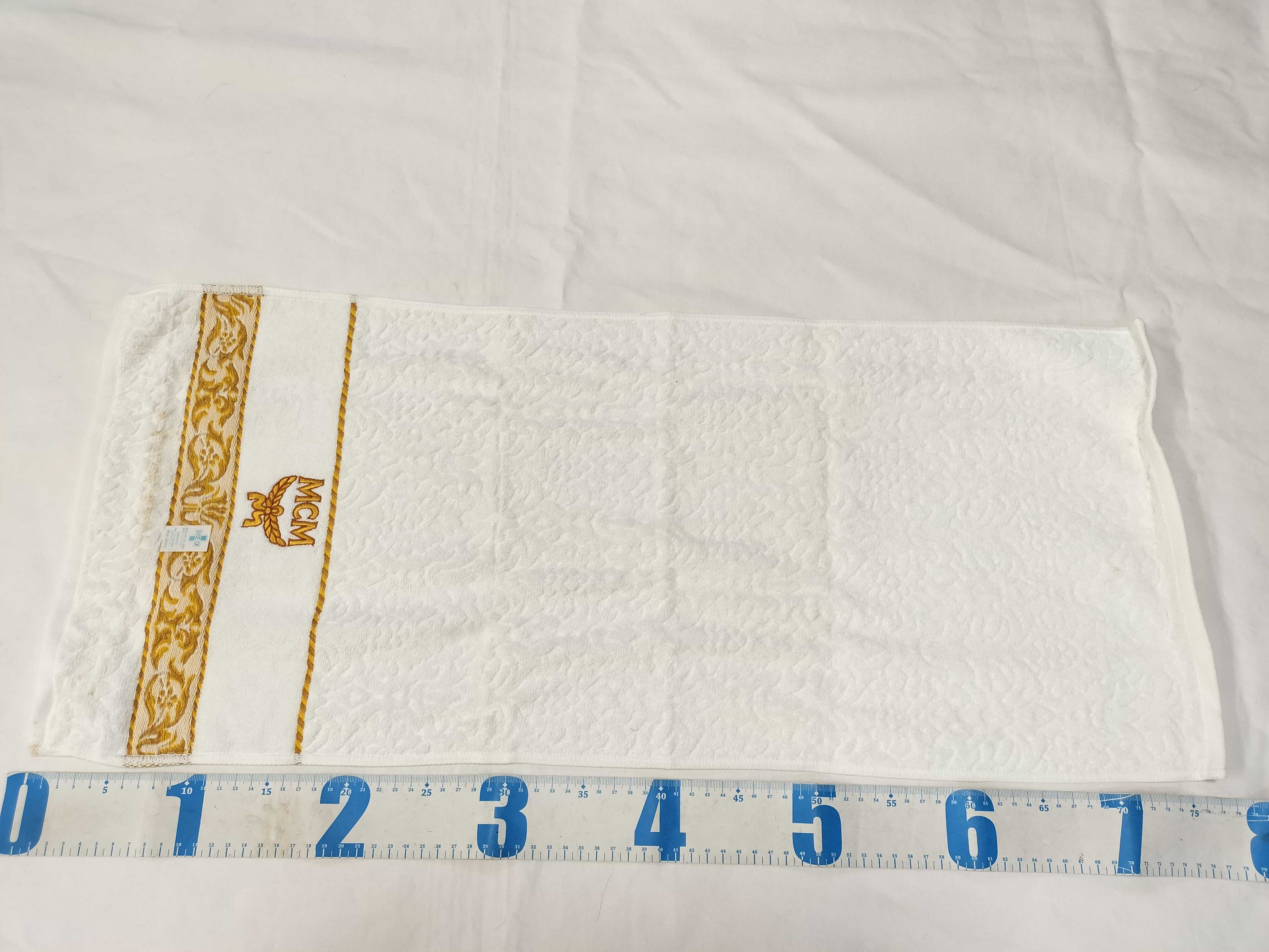 A Trio of MCM Branded Hand Towels