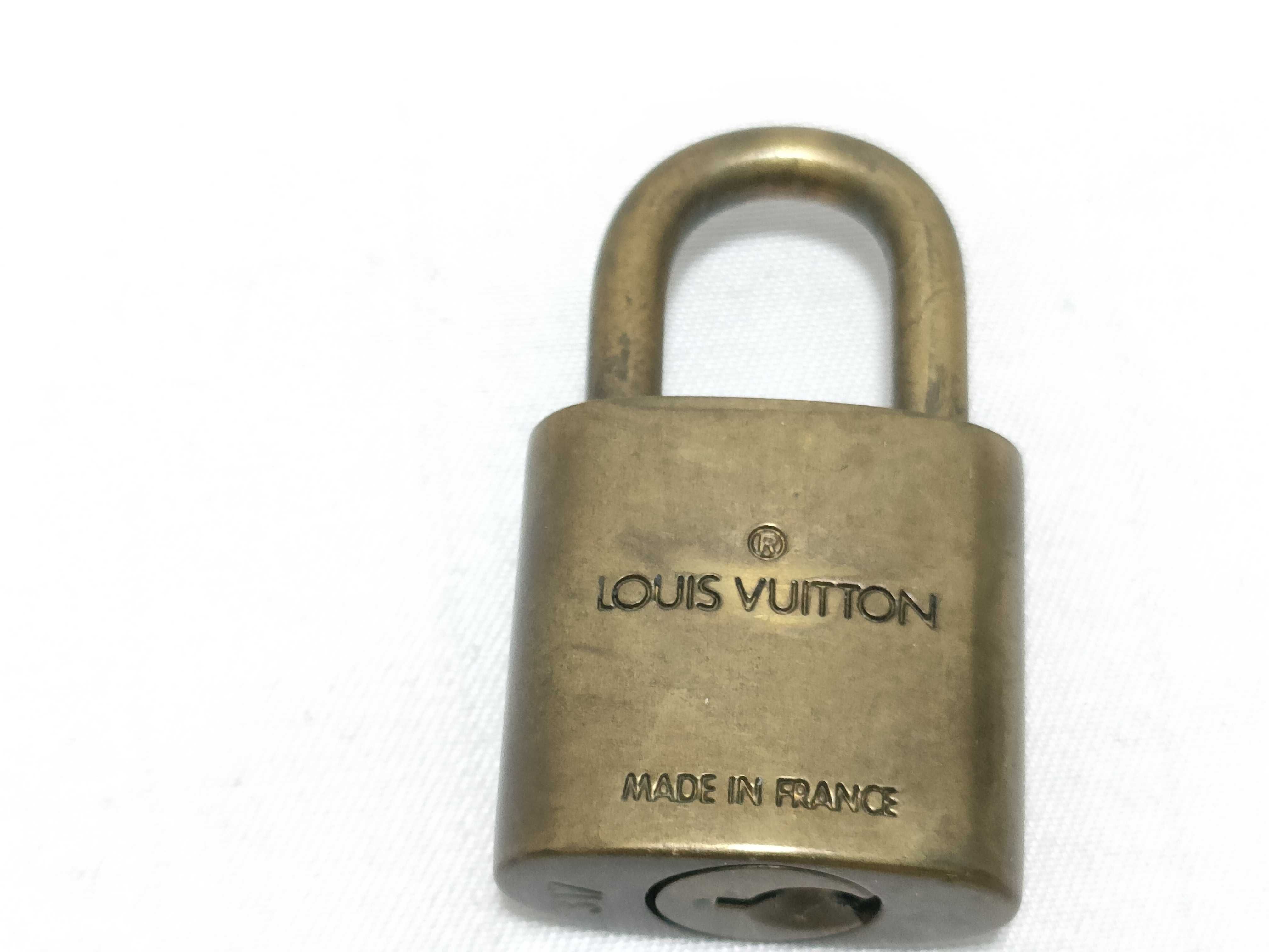 A Trio of Authentic Louis Vuitton Brass Padlocks with Keys