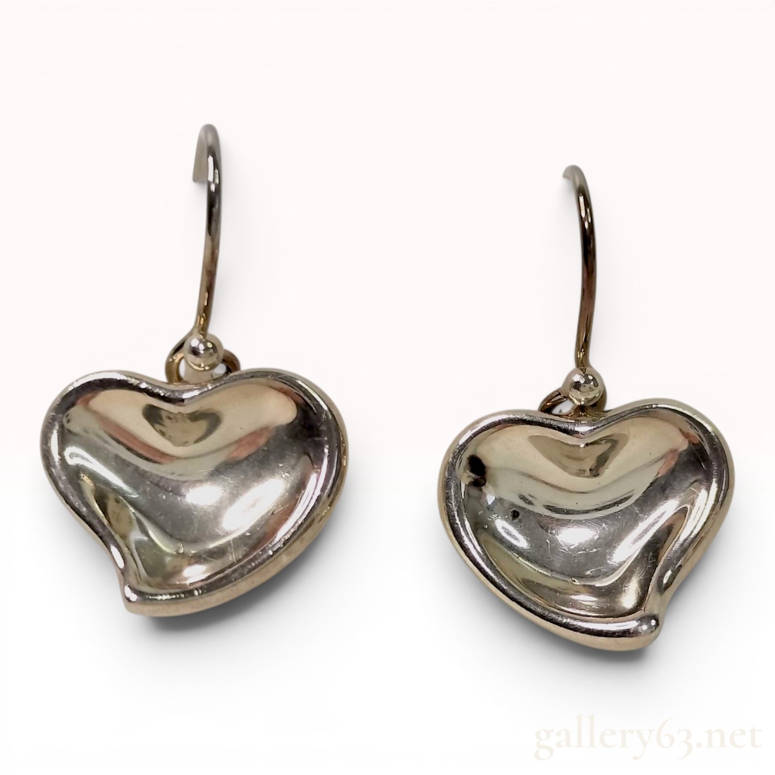 A Pair of Tiffany and Co. Elsa Peretti Sterling Silver Full Heart Drop Earrings