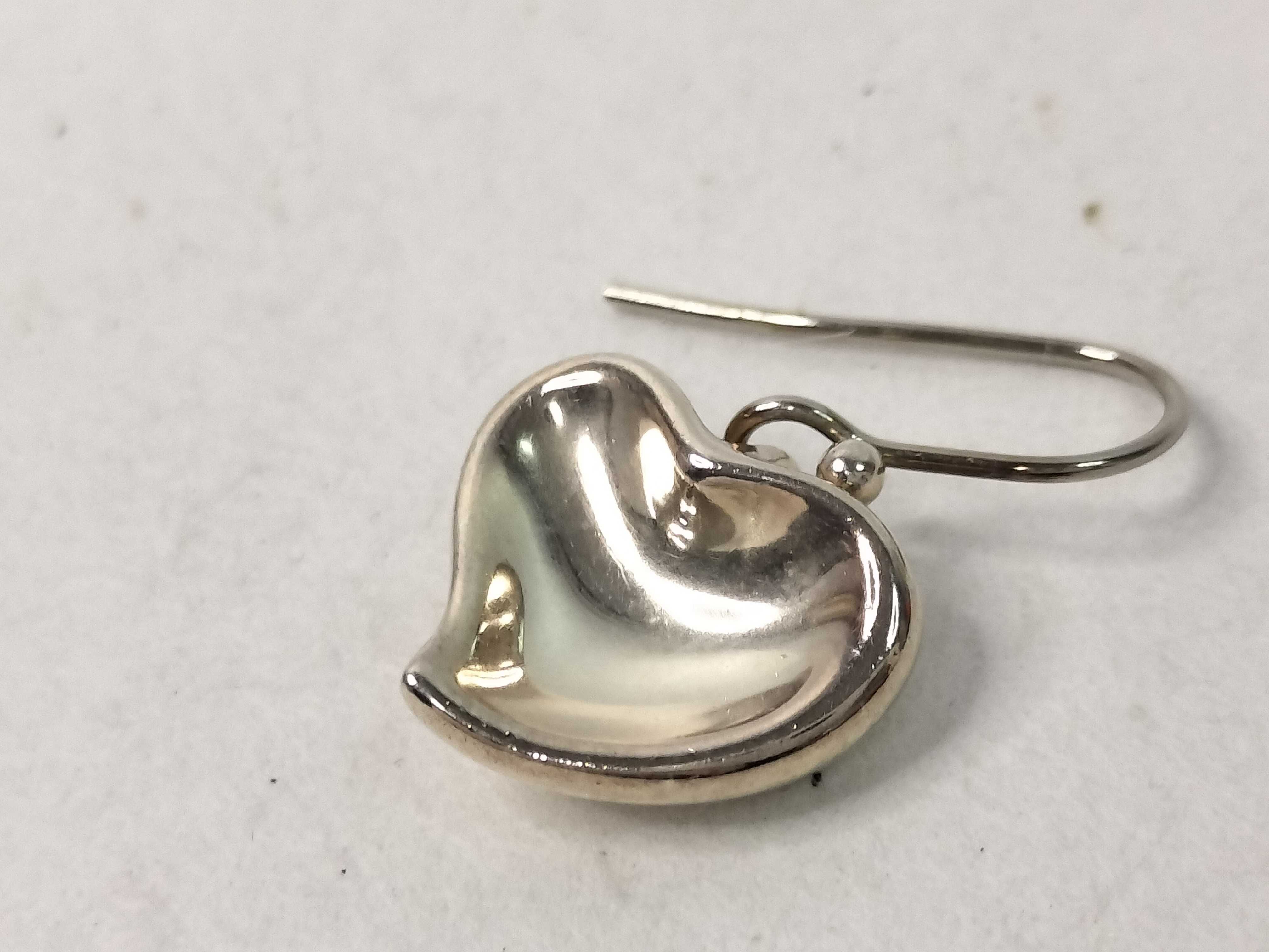 A Pair of Tiffany and Co. Elsa Peretti Sterling Silver Full Heart Drop Earrings