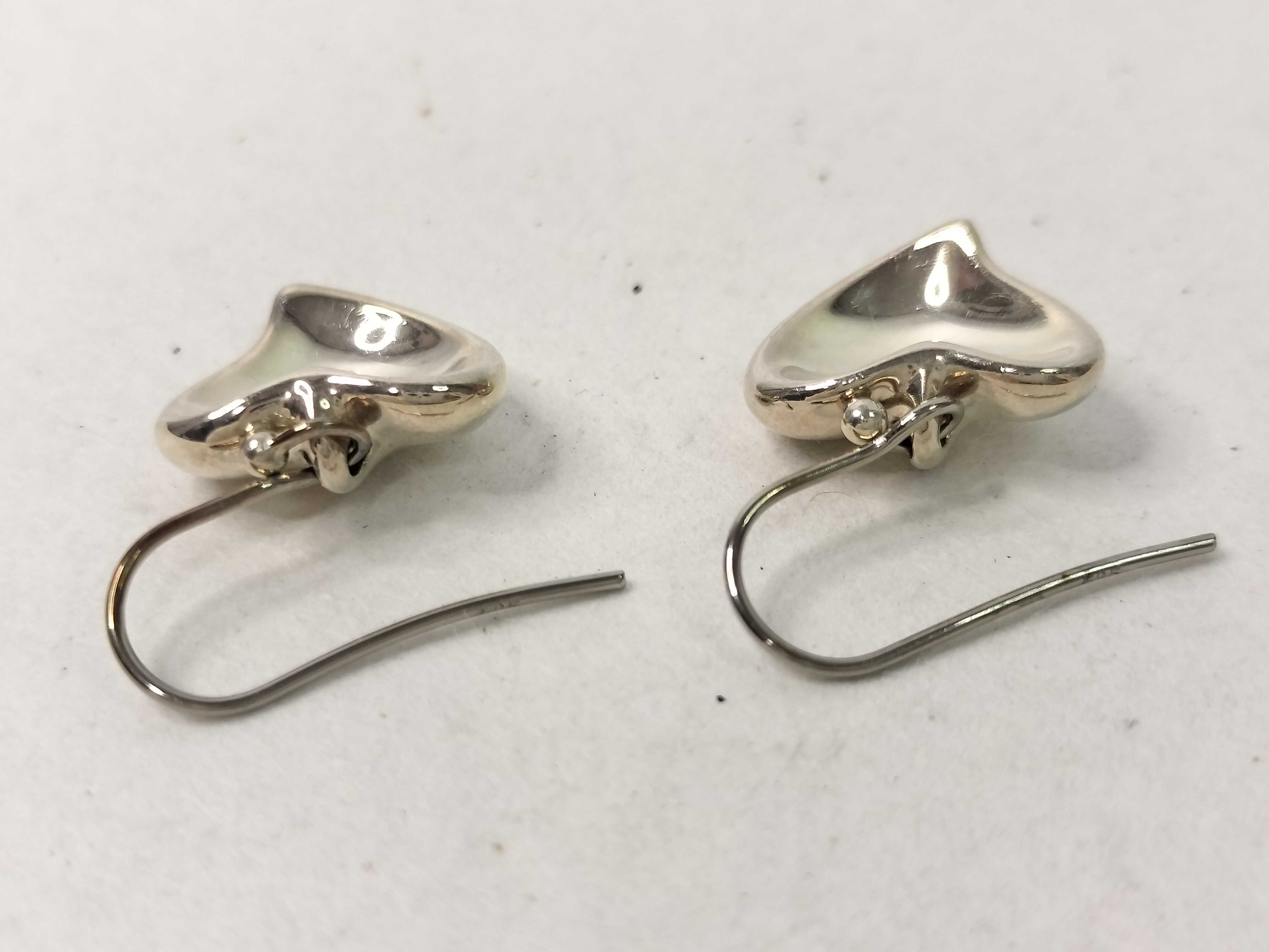A Pair of Tiffany and Co. Elsa Peretti Sterling Silver Full Heart Drop Earrings