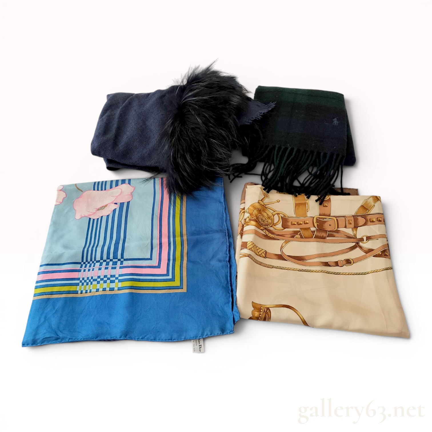 A Group of Four Designer Silk and Wool Scarves and Wraps