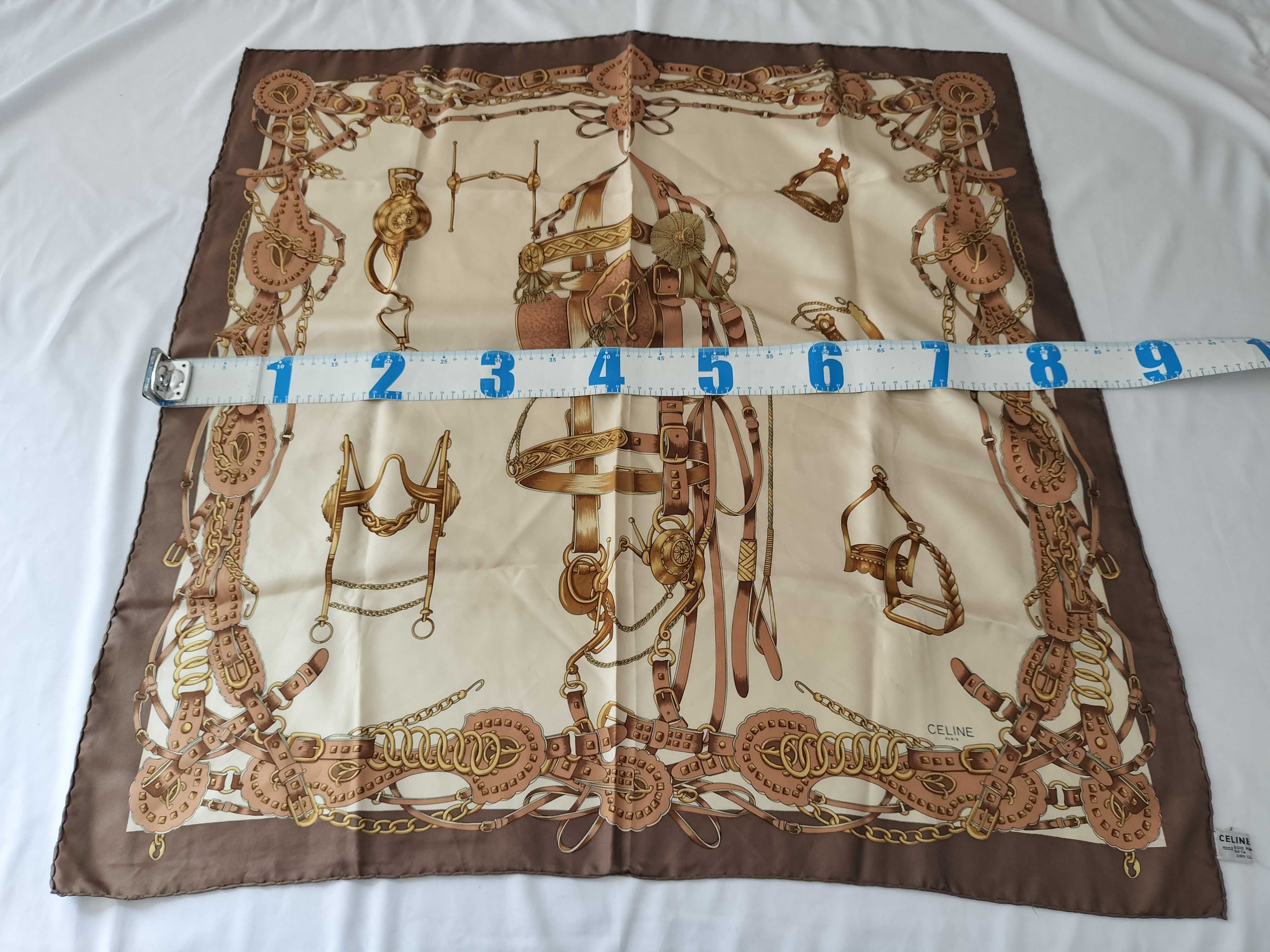 A Group of Four Designer Silk and Wool Scarves and Wraps