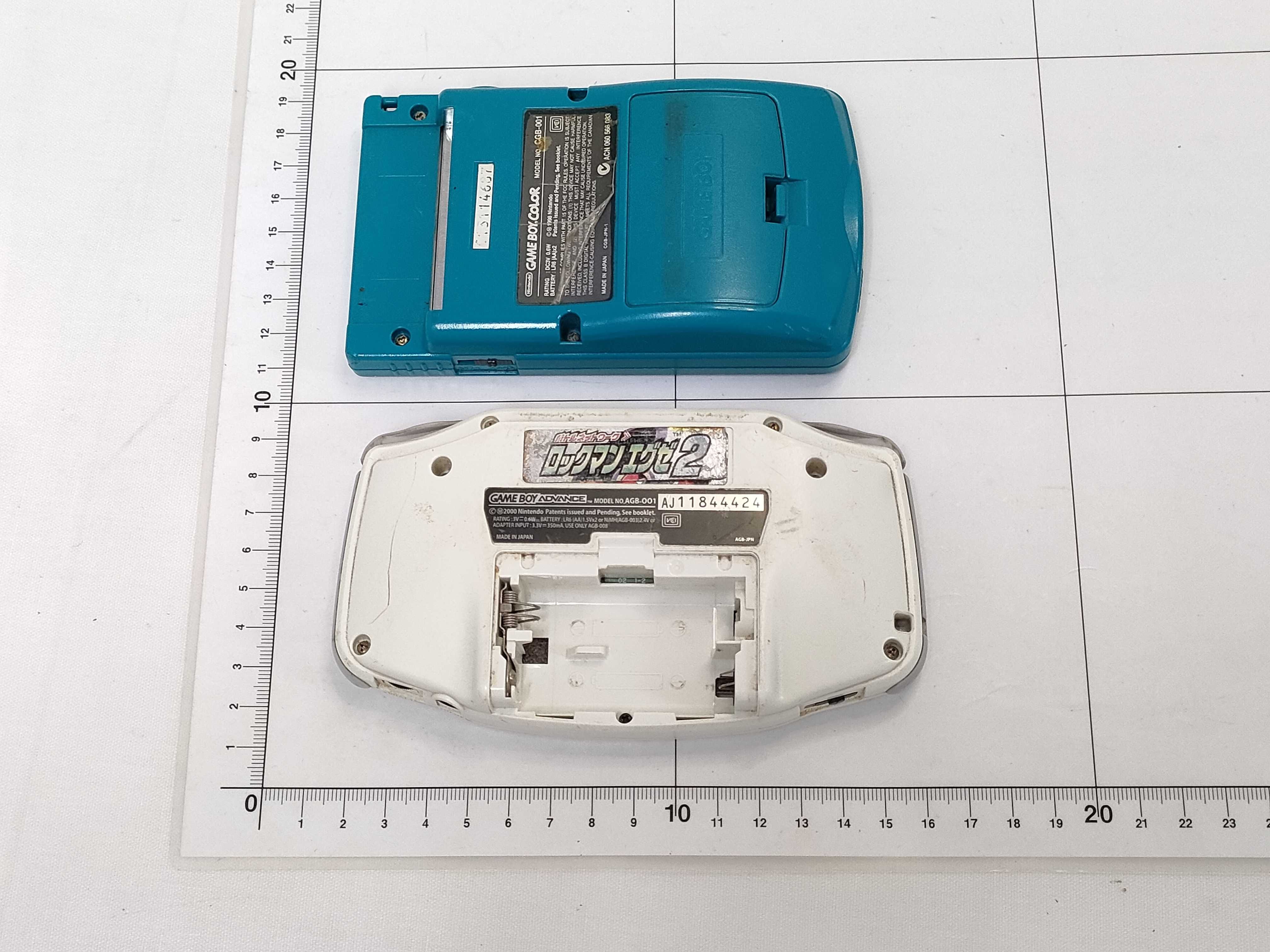 Three Nintendo Handheld Consoles, Two Game Boy Color Teal CGB-001 and One Game Boy Advance Glacier AGB-001