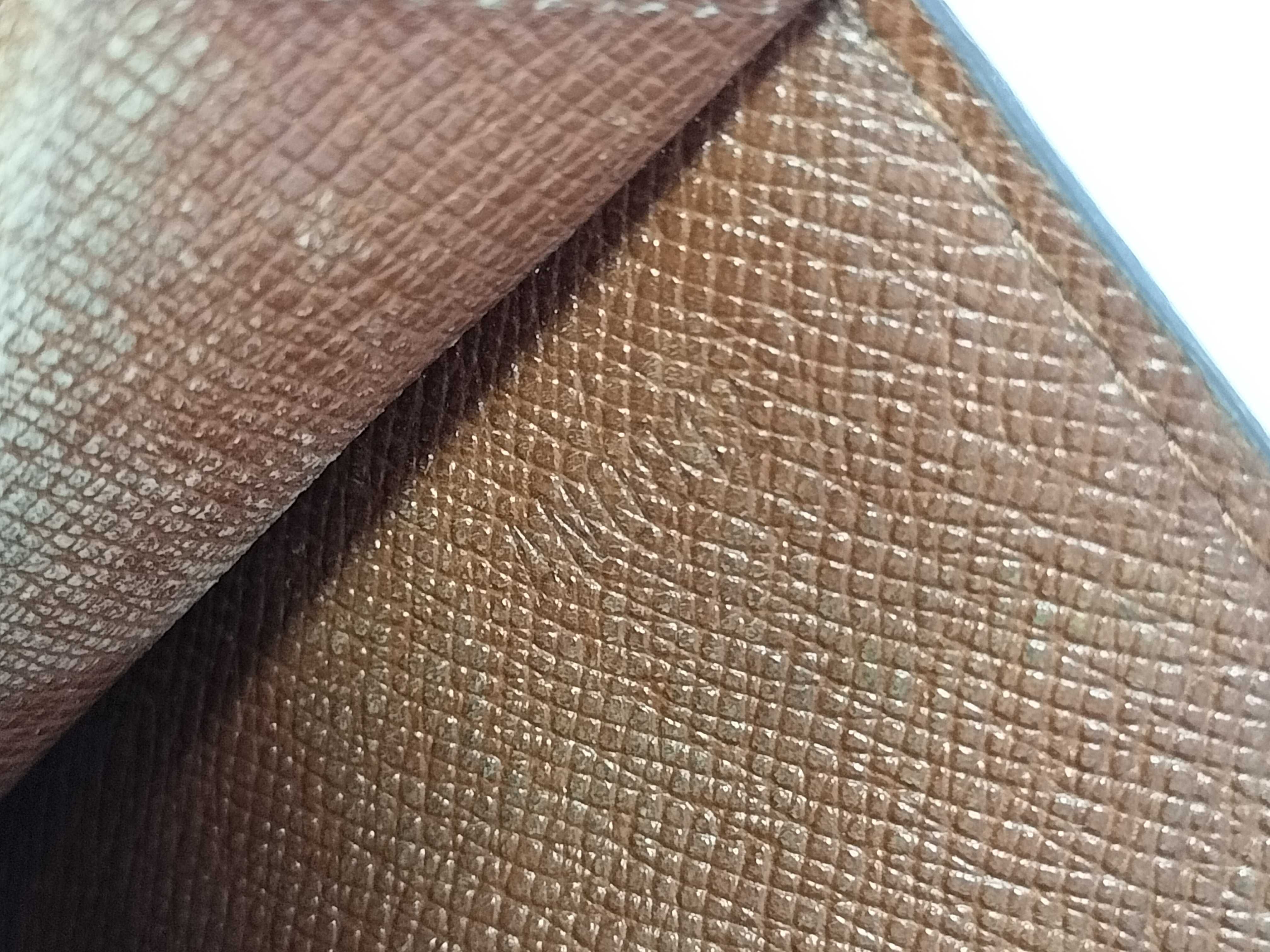 A Collection of Five Louis Vuitton Monogram Coated Canvas Wallets