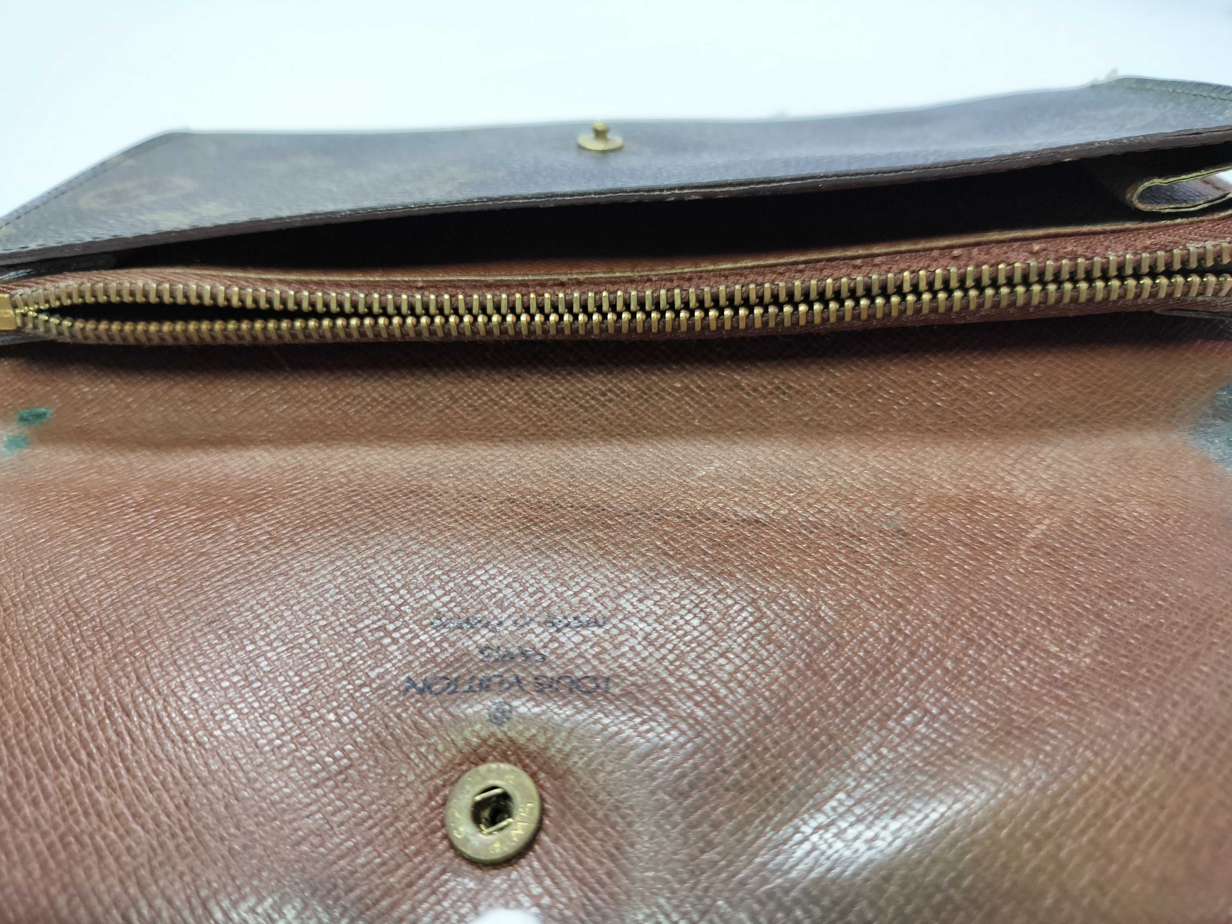 A Collection of Five Louis Vuitton Monogram Coated Canvas Wallets