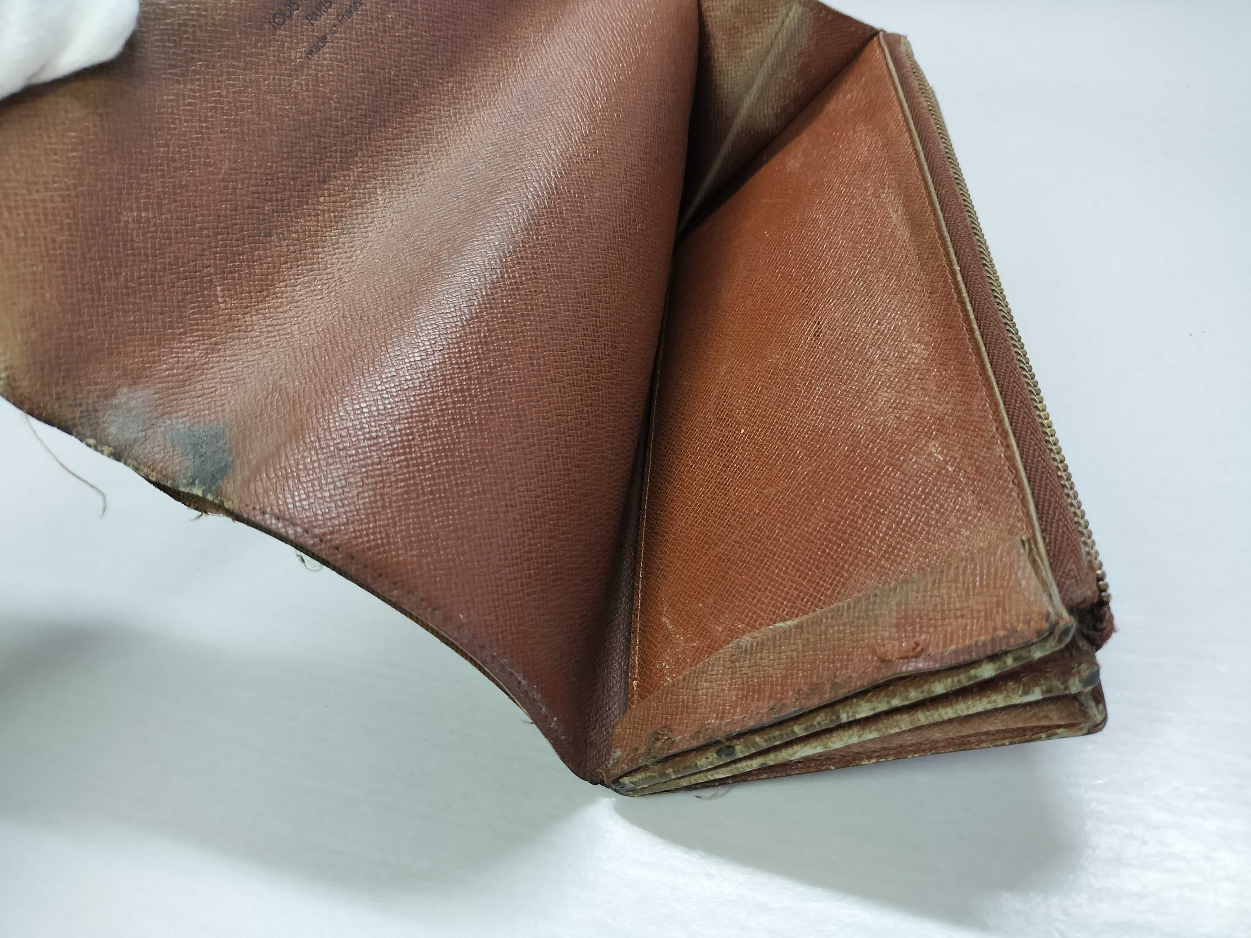A Collection of Five Louis Vuitton Monogram Coated Canvas Wallets