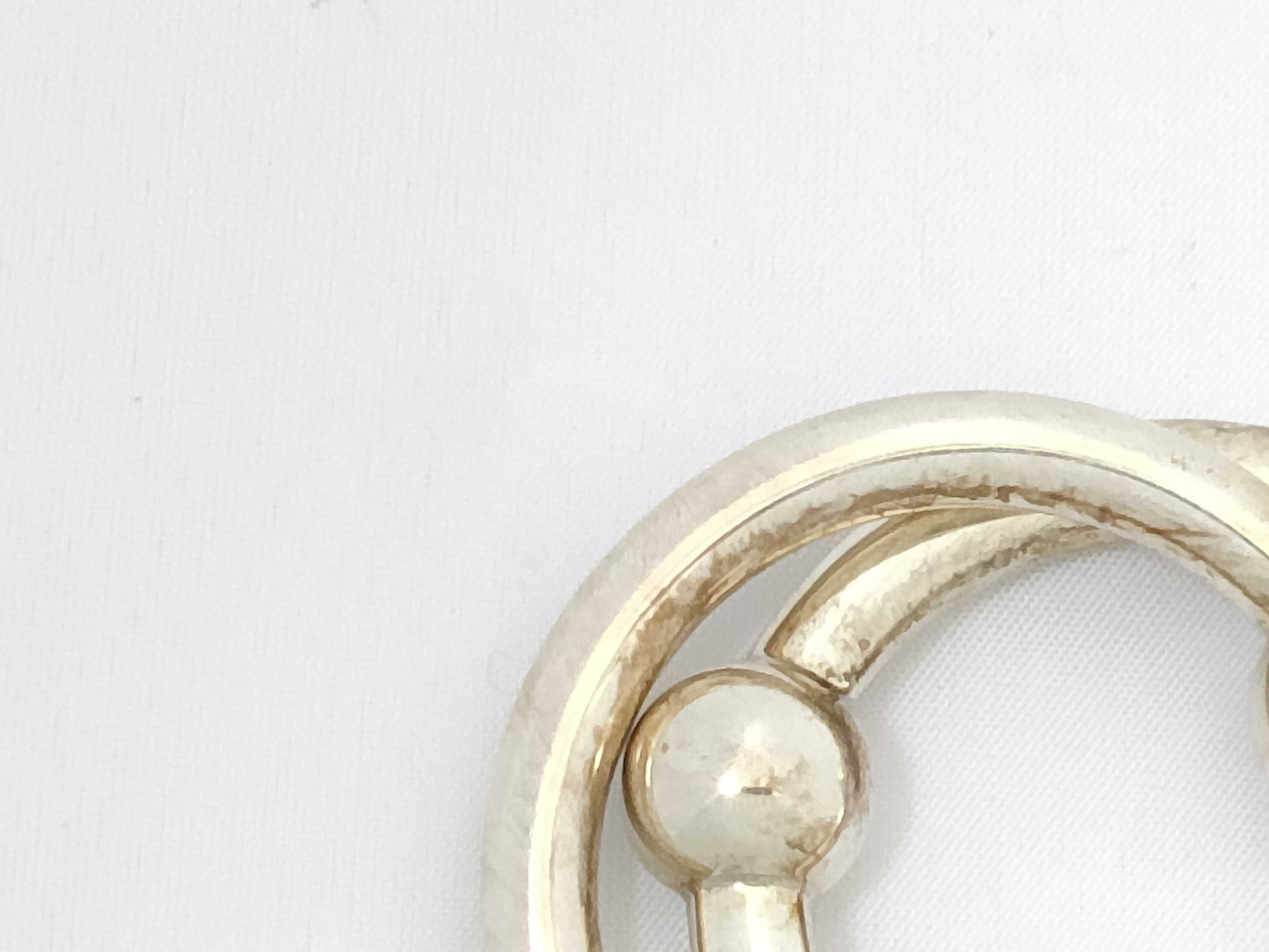 A Pair of Tiffany and Co. Sterling Silver Interlocking Baby Teething Rings