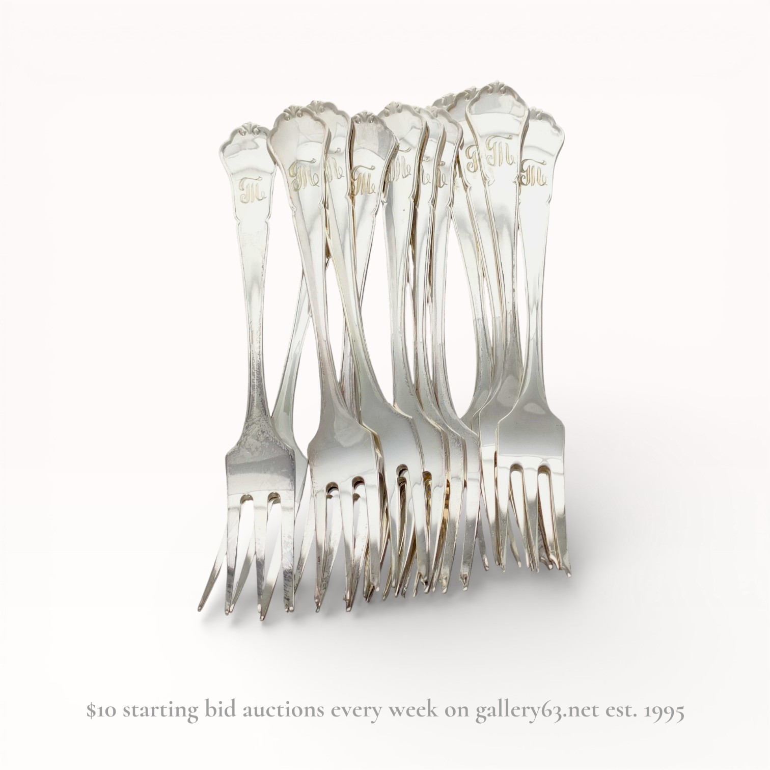 A Set of Nine 830 Silver Three-Tine Forks with Shell Terminals, Late 19th-early 20th C.