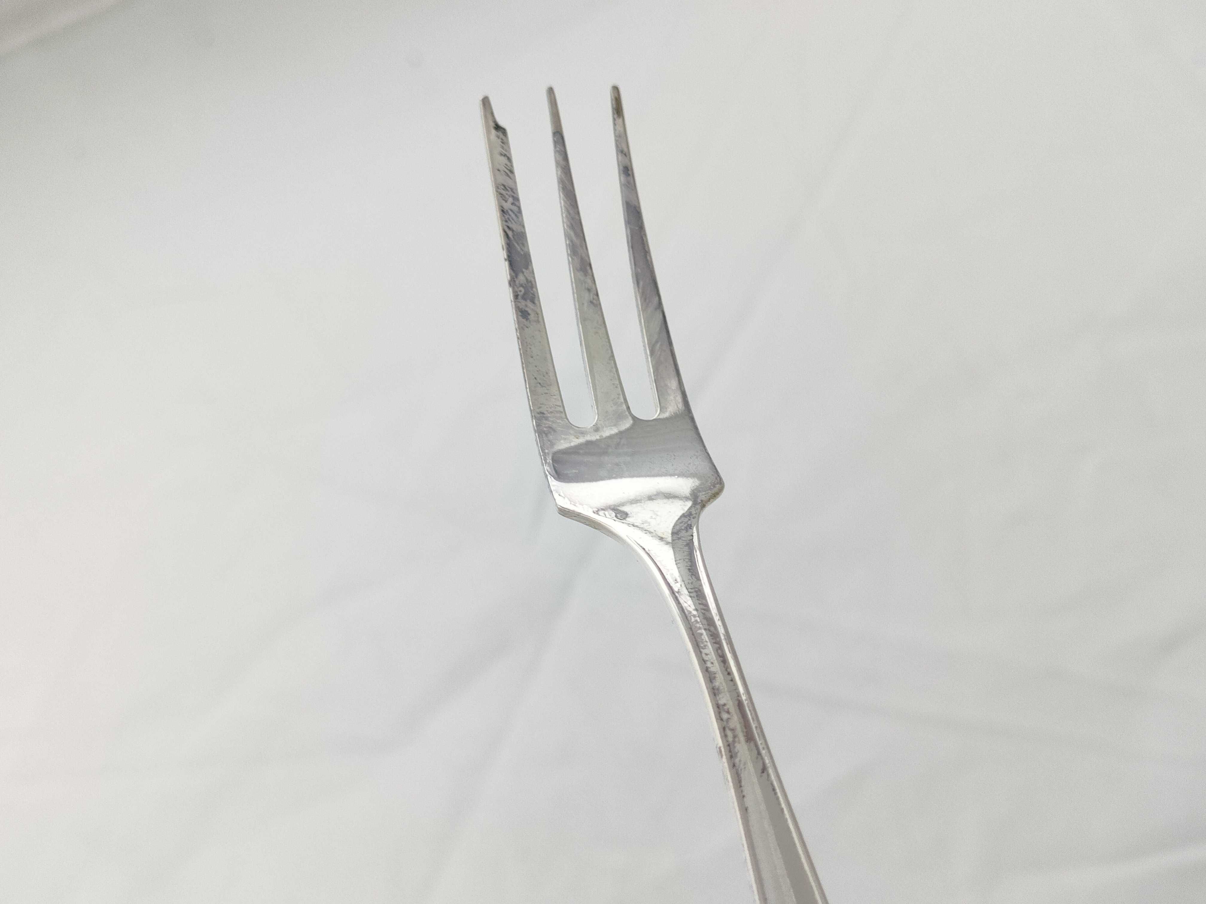 A Set of Nine 830 Silver Three-Tine Forks with Shell Terminals, Late 19th-early 20th C.