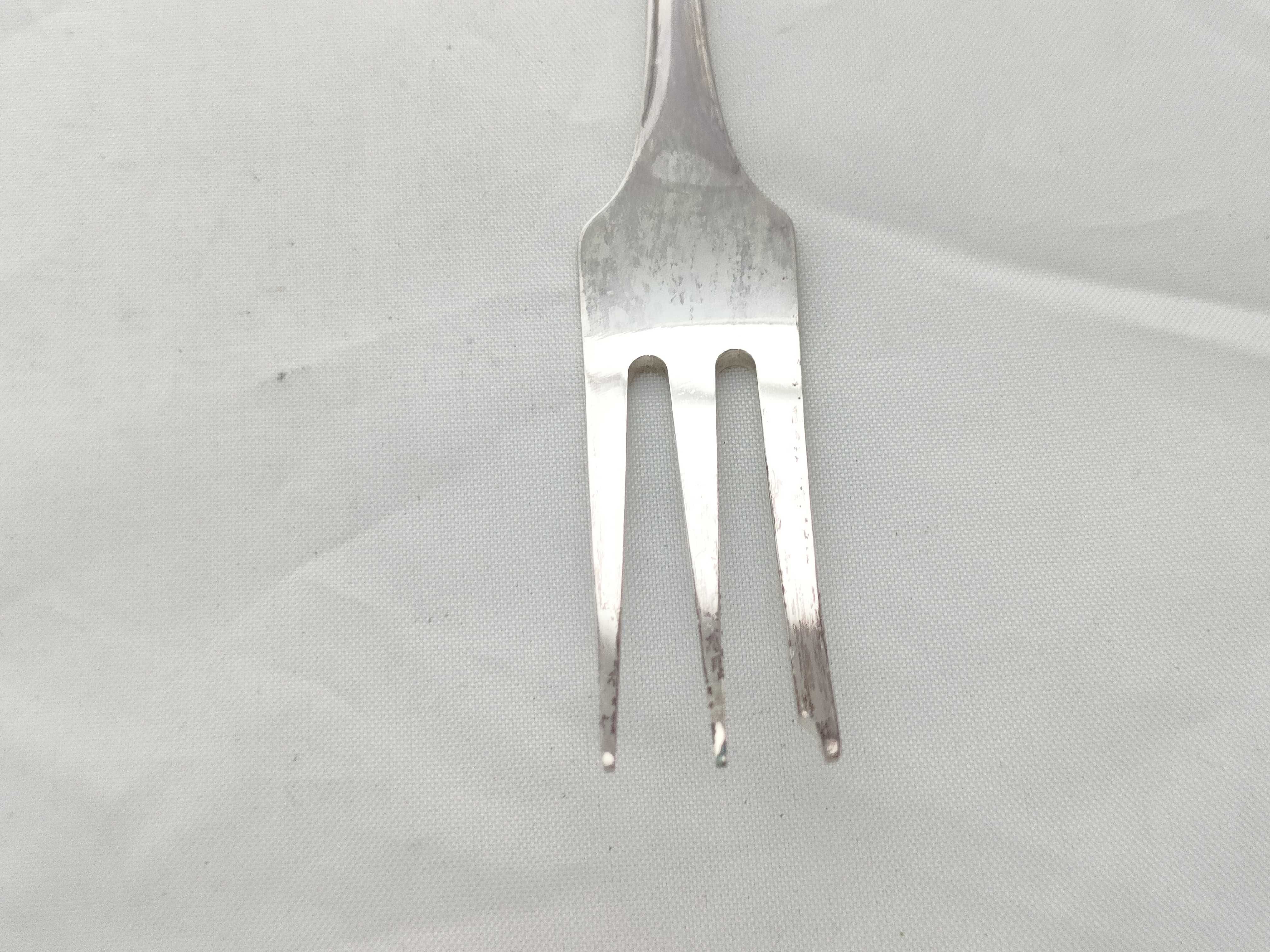 A Set of Nine 830 Silver Three-Tine Forks with Shell Terminals, Late 19th-early 20th C.