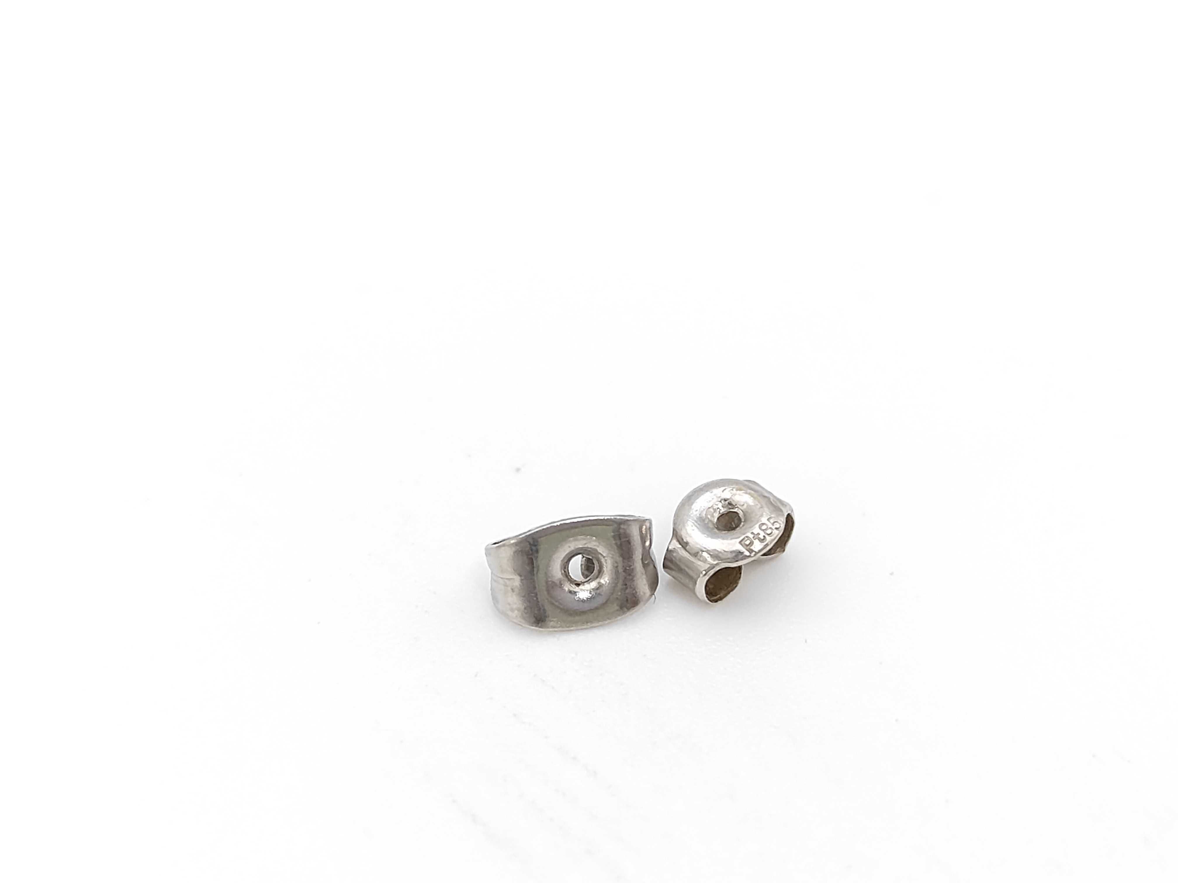 A Pair of 1.5ctw Platinum and Round Brilliant Cut Colorless Natural Diamond Stud Earrings