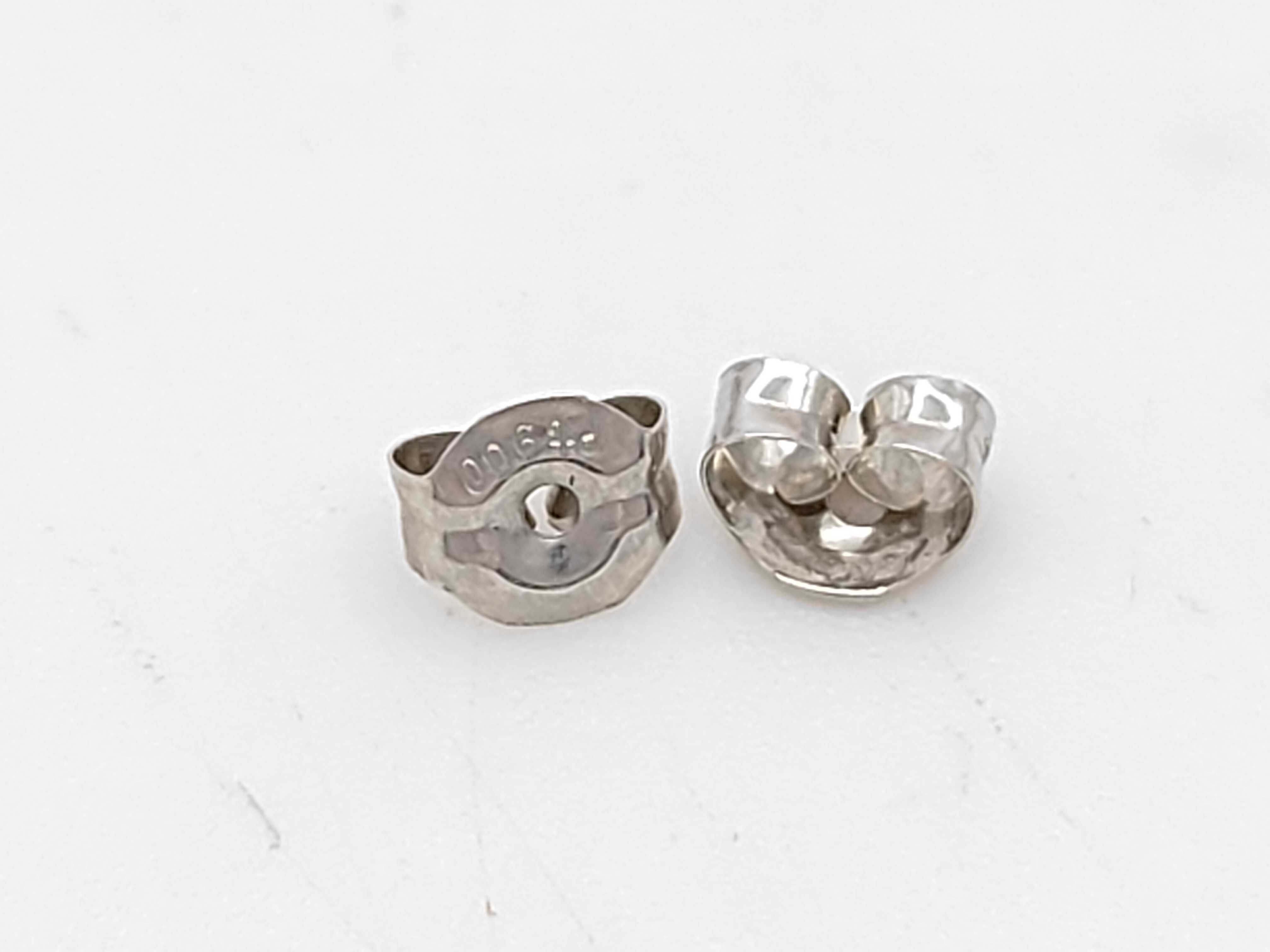 A Pair of Platinum, Sapphire, and Diamond Halo Stud Earrings